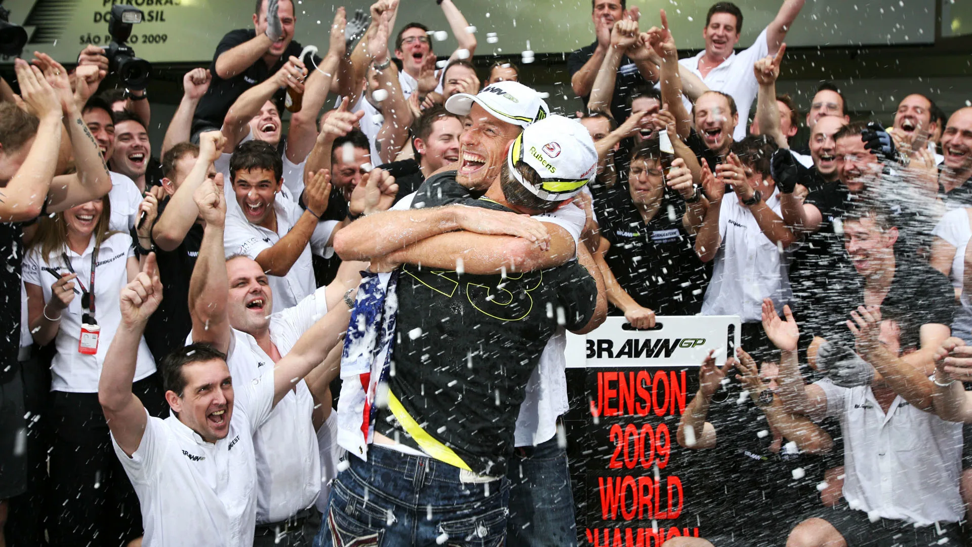 Rubens Barrichello (BRA) Brawn Grand Prix and World Champion Jenson Button (GBR) Brawn Grand Prix