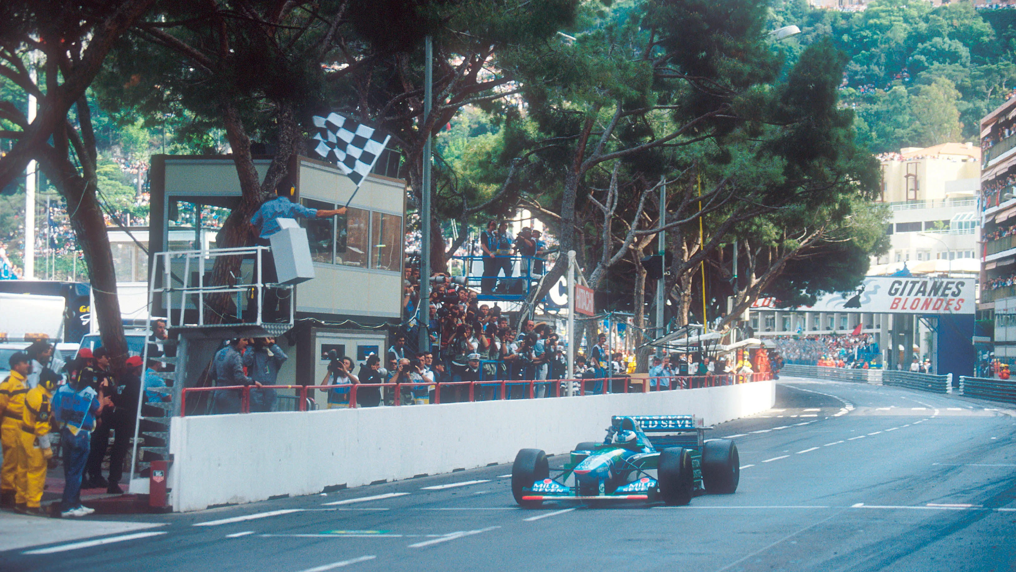 Monte Carlo, Monaco. 12-15 May 1994. Michael Schumacher (Benetton B194 Ford) takes the chequered