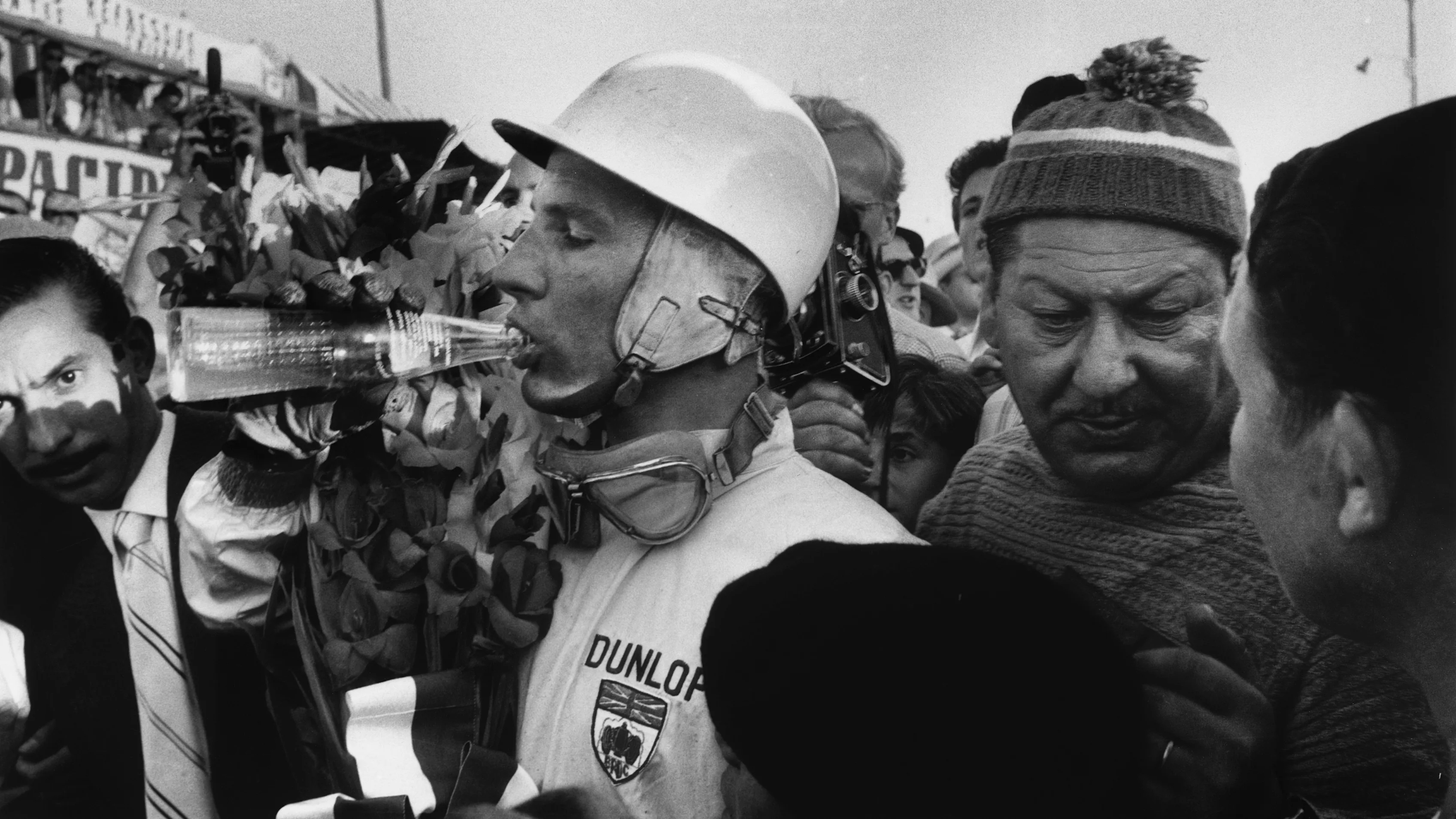 Monsanto, Portugal. 23 August 1959. Stirling Moss, Cooper T51-Climax, 1st position, drinks after
