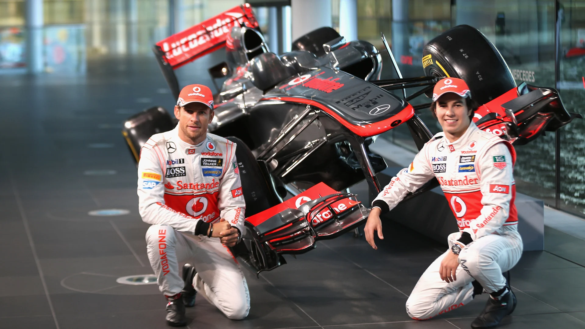 WOKING, ENGLAND - JANUARY 31: (L - R) McLaren Mercedes Formula 1 drivers Jenson Button of Great