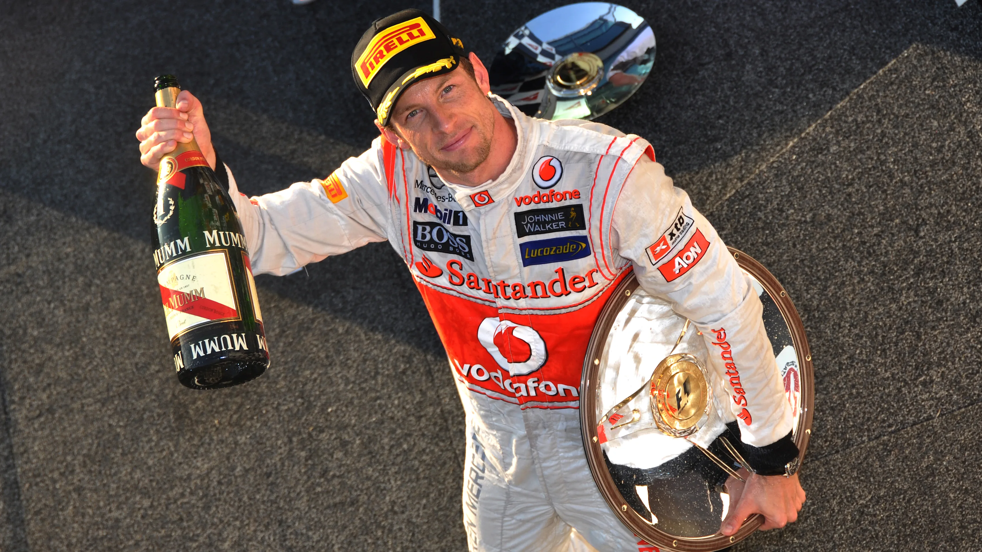 Race winner Jenson Button (GBR) McLaren on the podium. Formula One World Championship, Australian