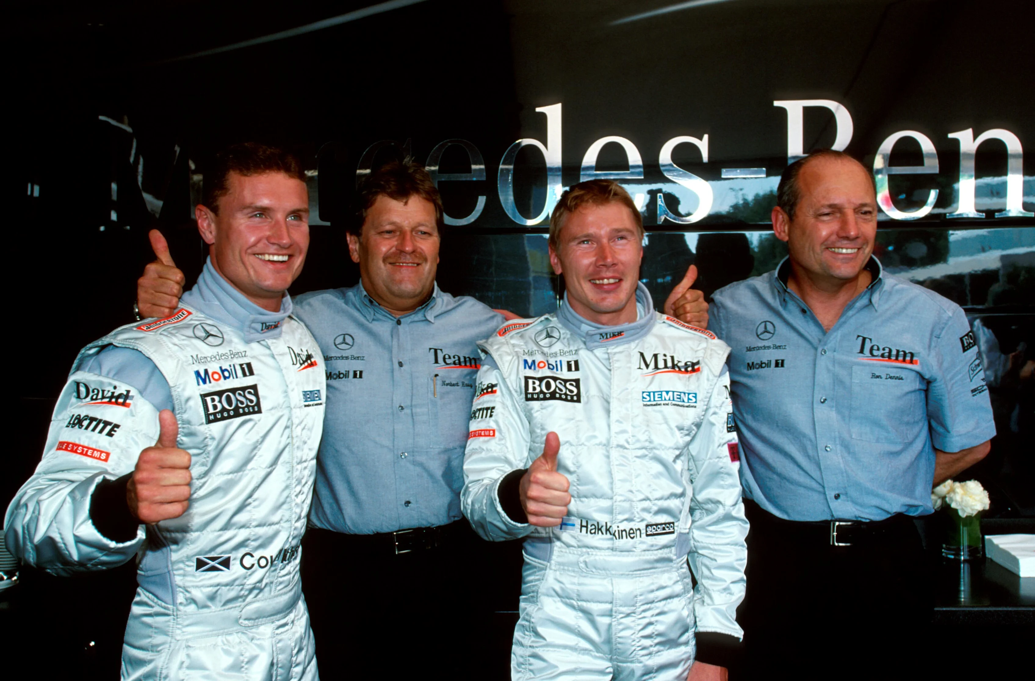 L to R: Winner David Coulthard, Norbert Haug(GER) Mercedes Motorsport Boss, Mika Hakkinen and Ron