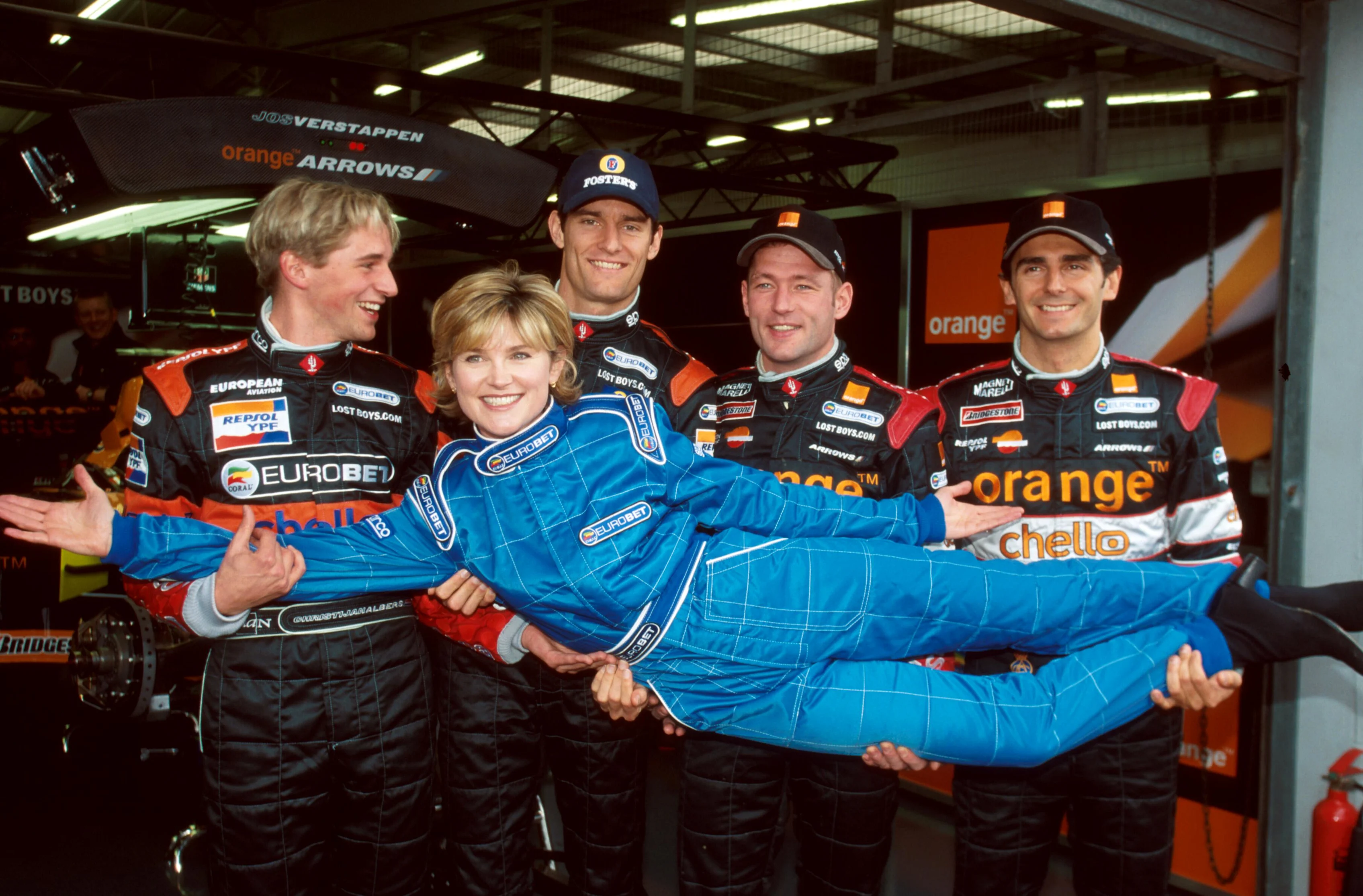 British TV celebrity Anthea Turner is given a helping hand by the Arrows drivers LtoR: Christijan