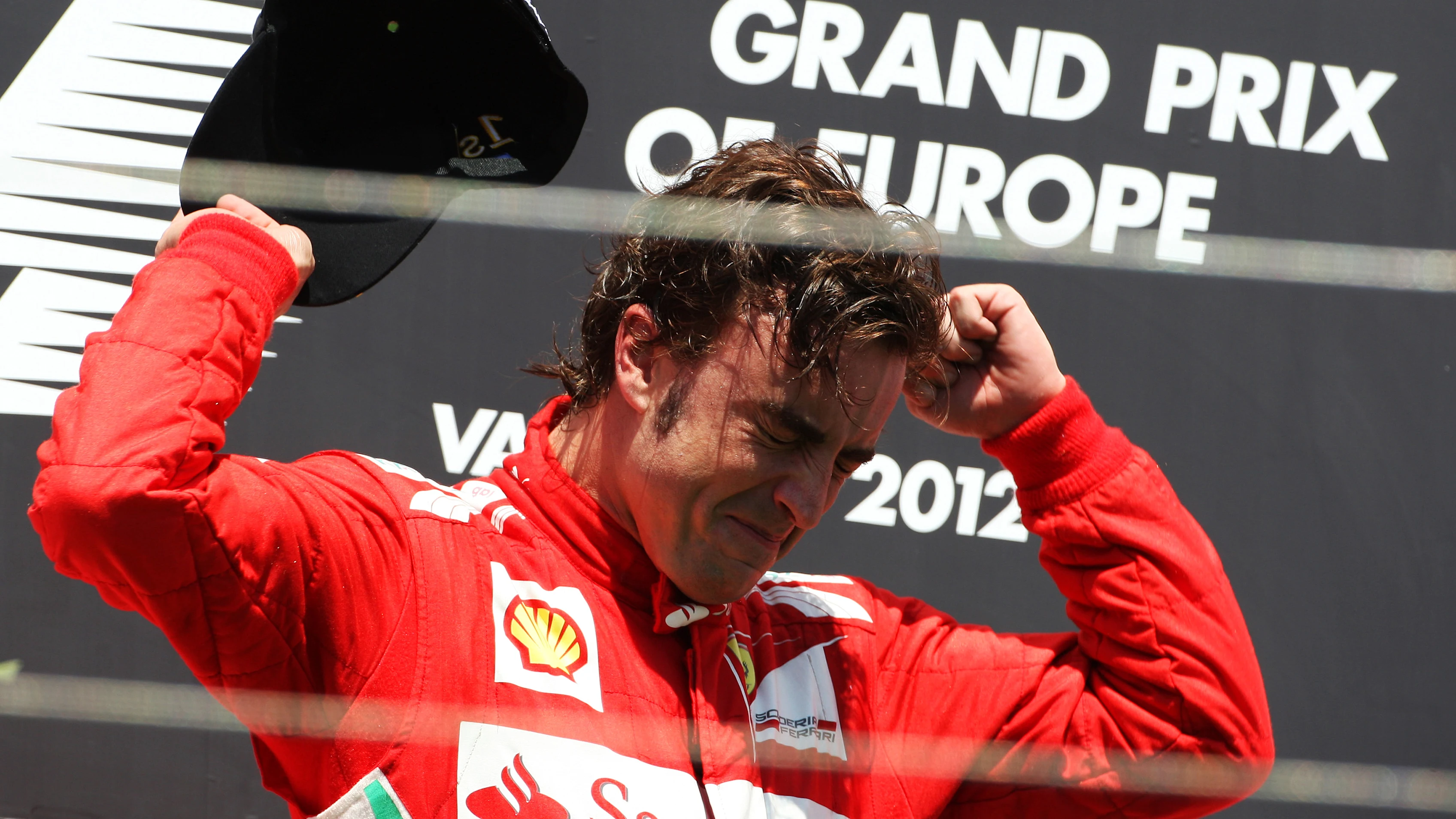 Race winner Fernando Alonso (ESP) Ferrari celebrates on the podium.\nFormula One World