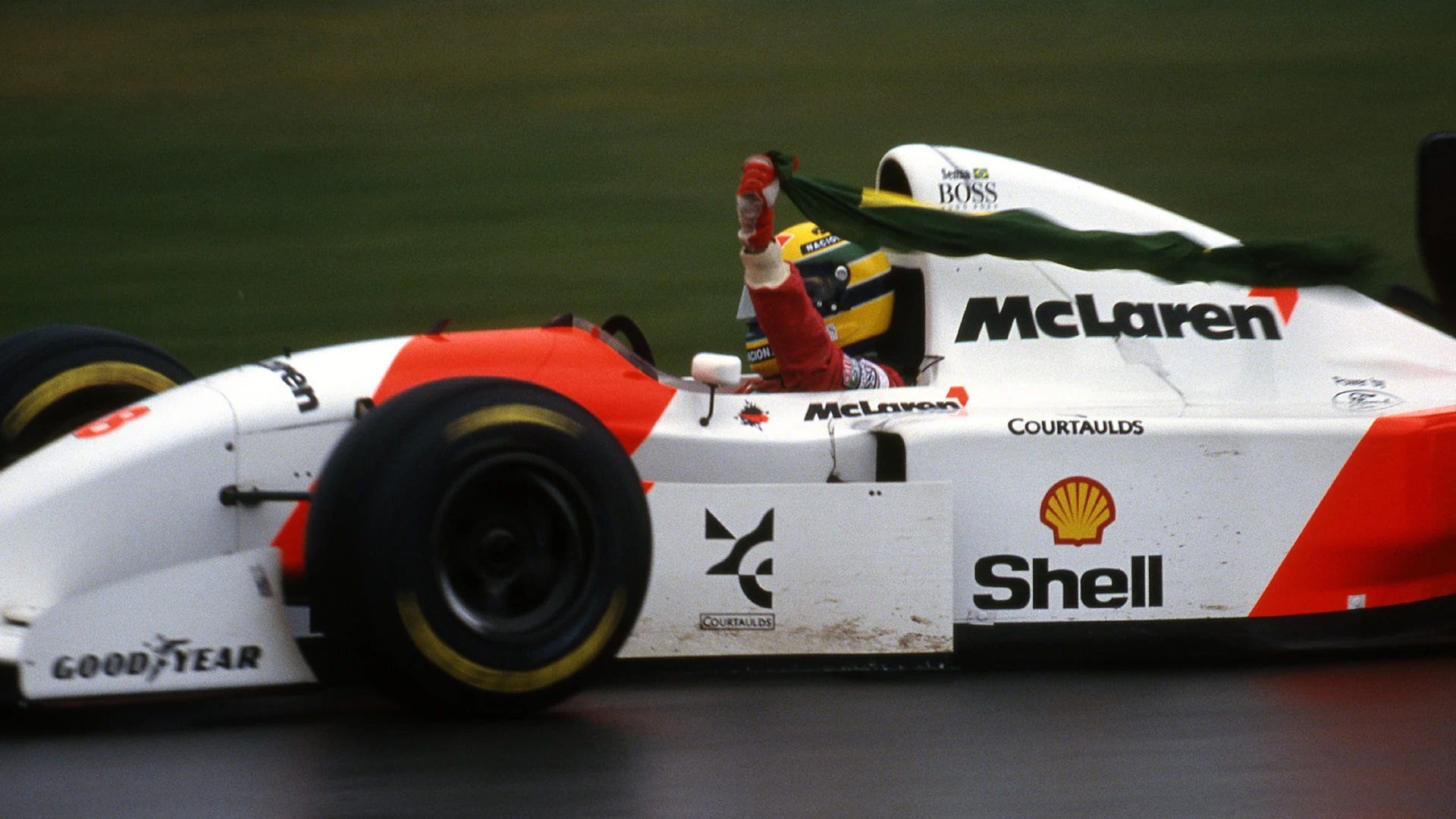 Ayrton Senna (BRA) McLaren Ford MP4/8 celebrates his win. European Grand Prix, Rd3, Donington