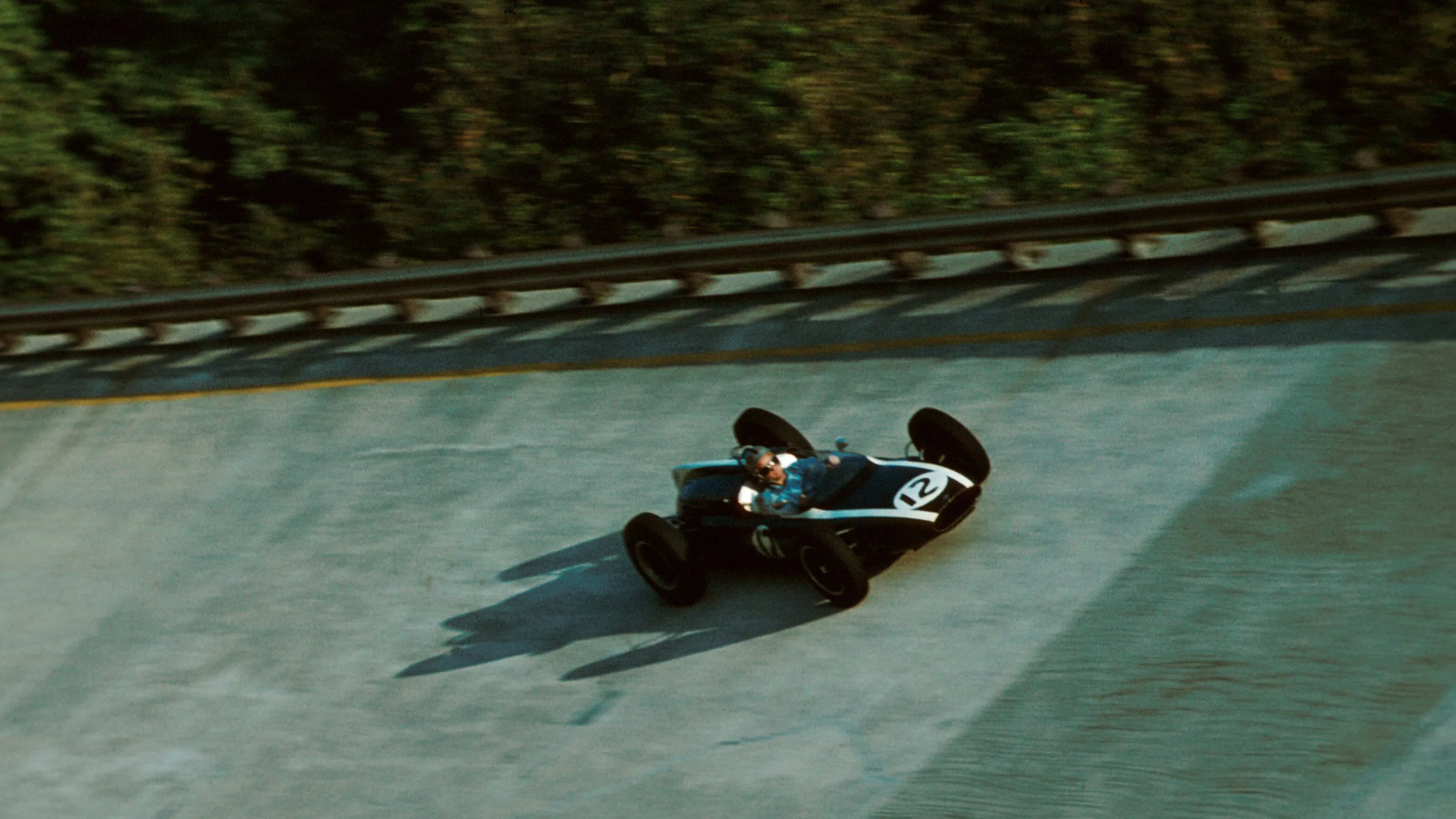 Bruce McLaren negotiates the banking in his Cooper T55. He finished in 3rd place, in the 1961 Italian Grand Prix. © Sutton Motorsport Images