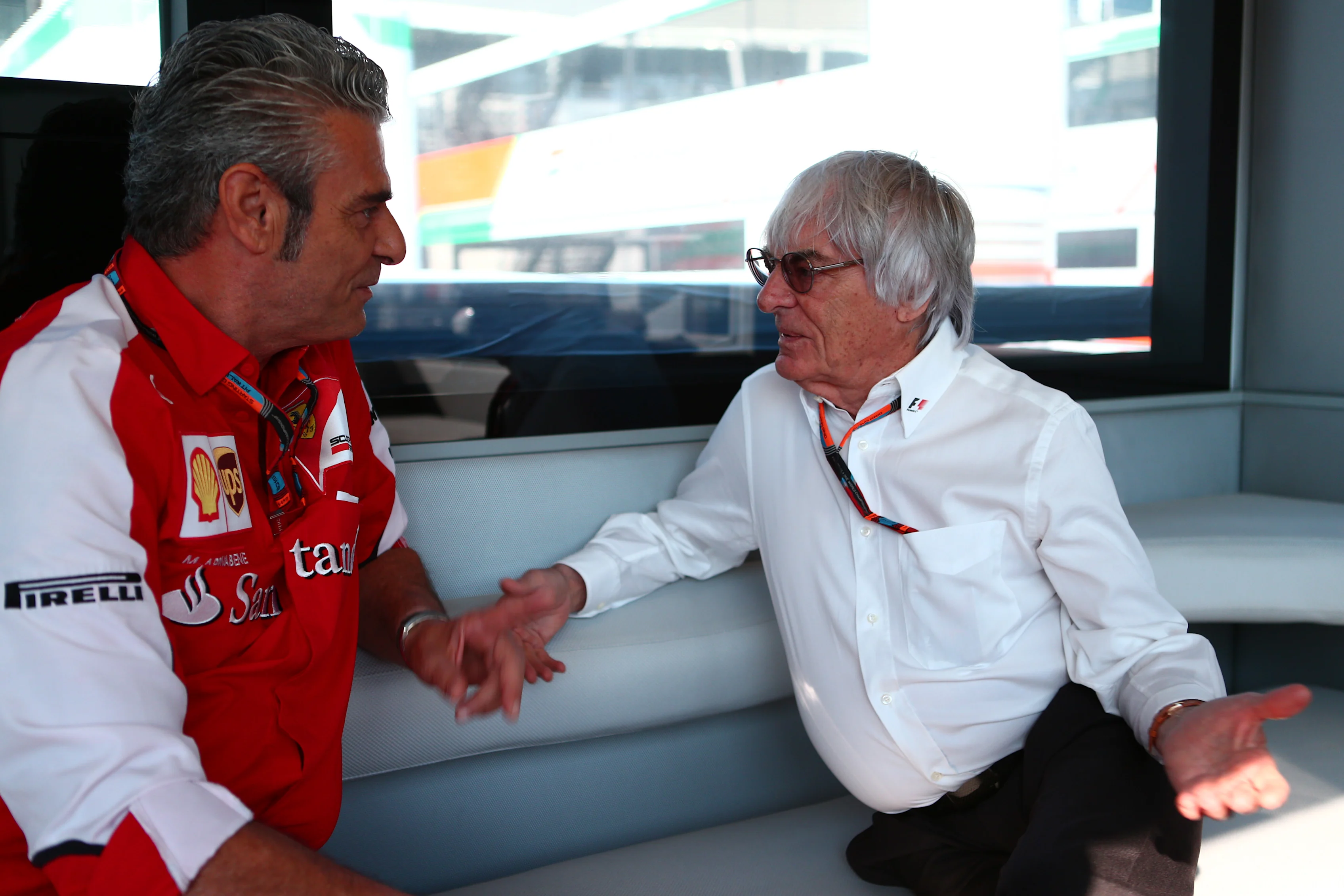 Formula One group CEO Bernie Ecclestone in conversation with Ferrari team principal Maurizio