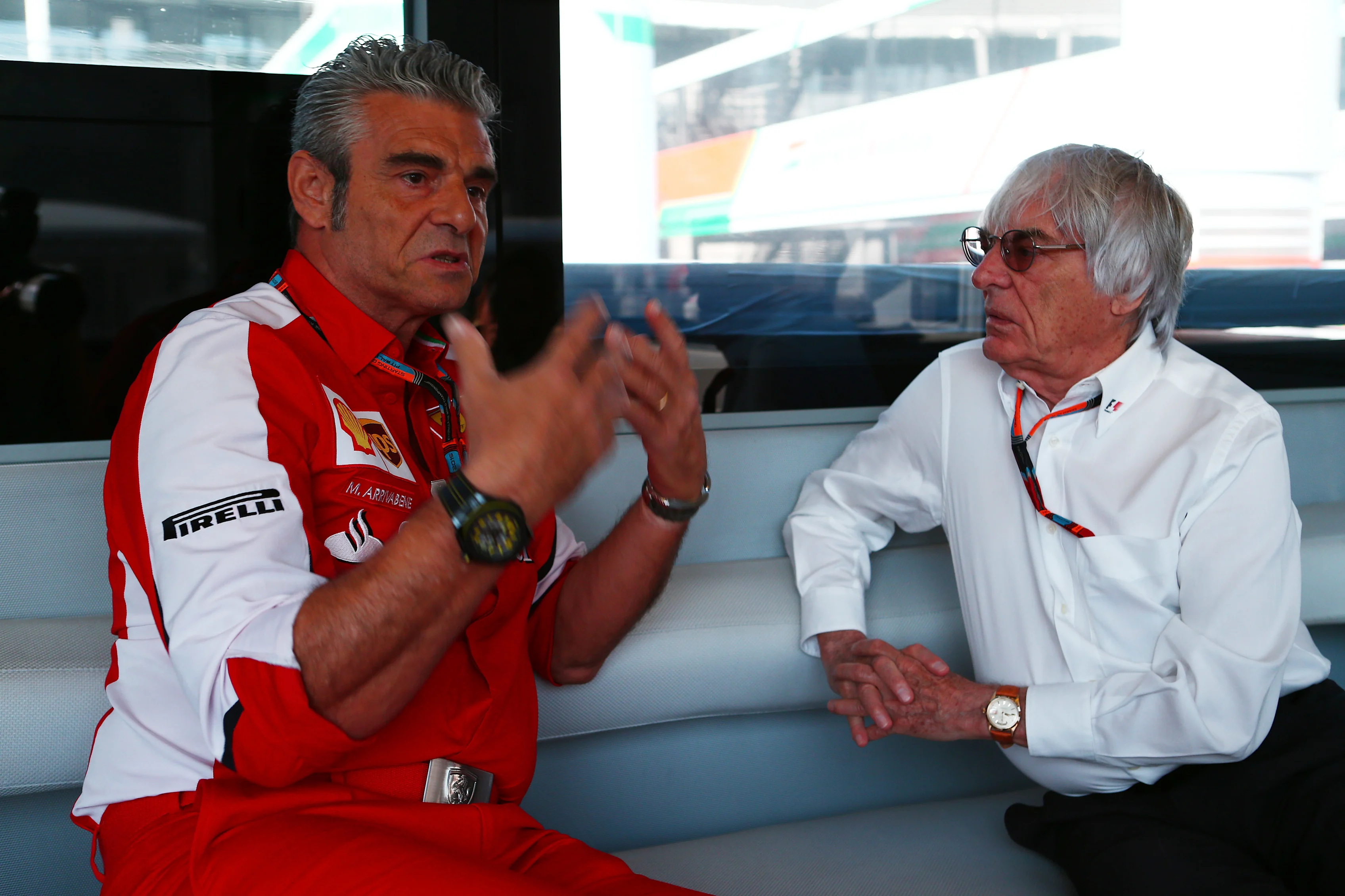 Formula One group CEO Bernie Ecclestone in conversation with Ferrari team principal Maurizio