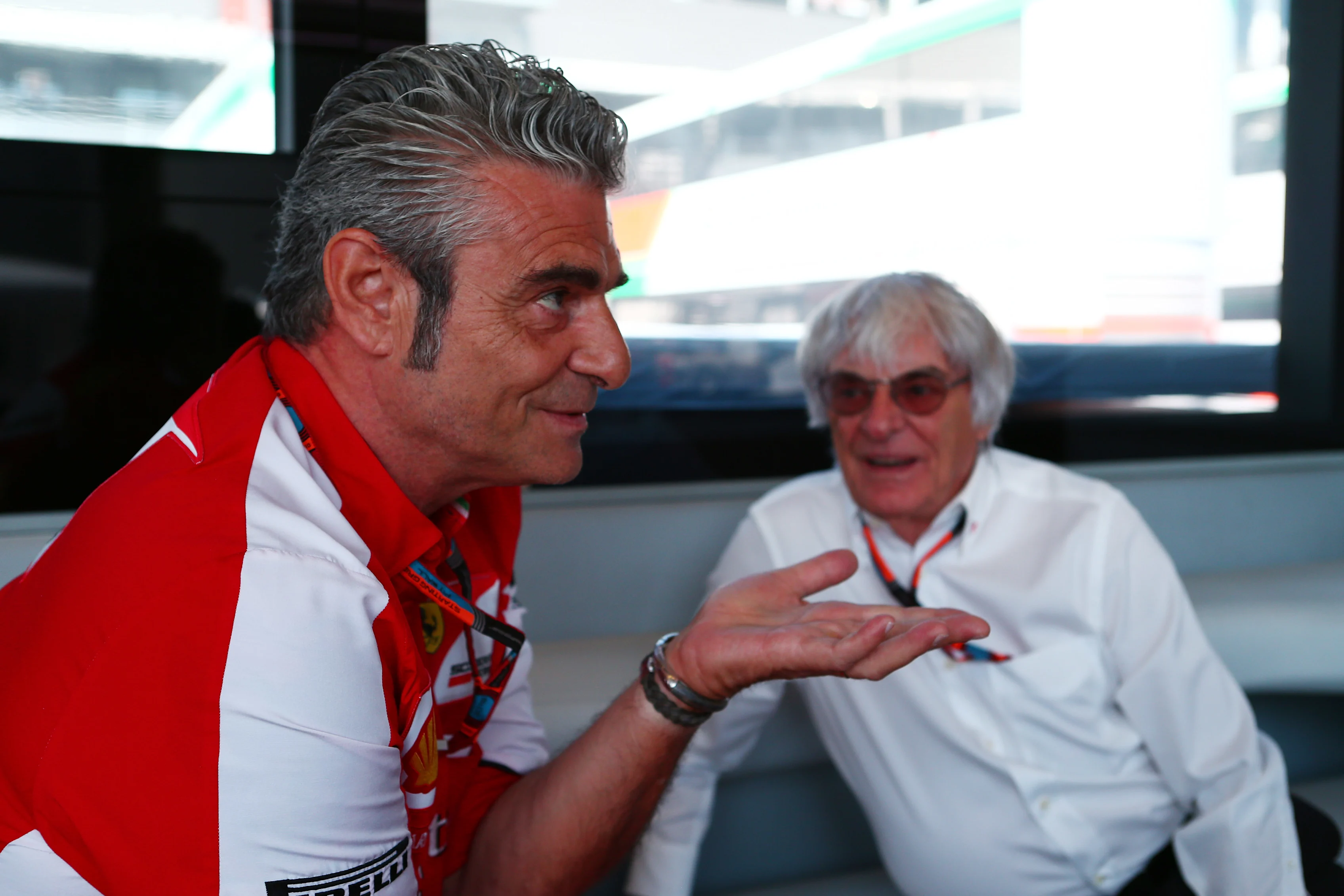 Formula One group CEO Bernie Ecclestone in conversation with Ferrari team principal Maurizio