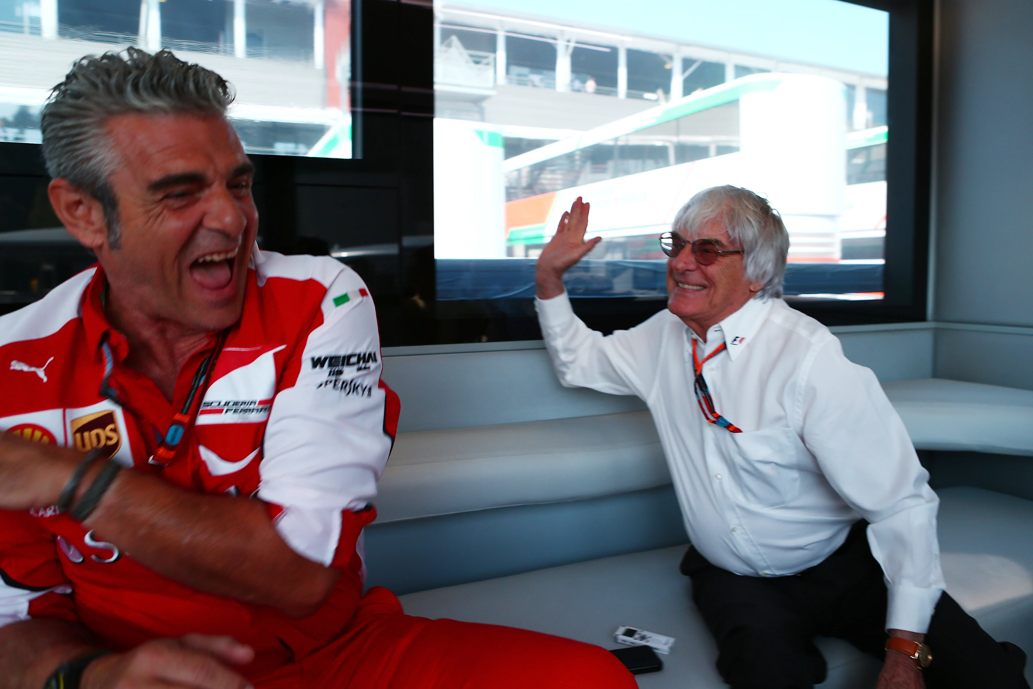 Formula One group CEO Bernie Ecclestone in conversation with Ferrari team principal Maurizio