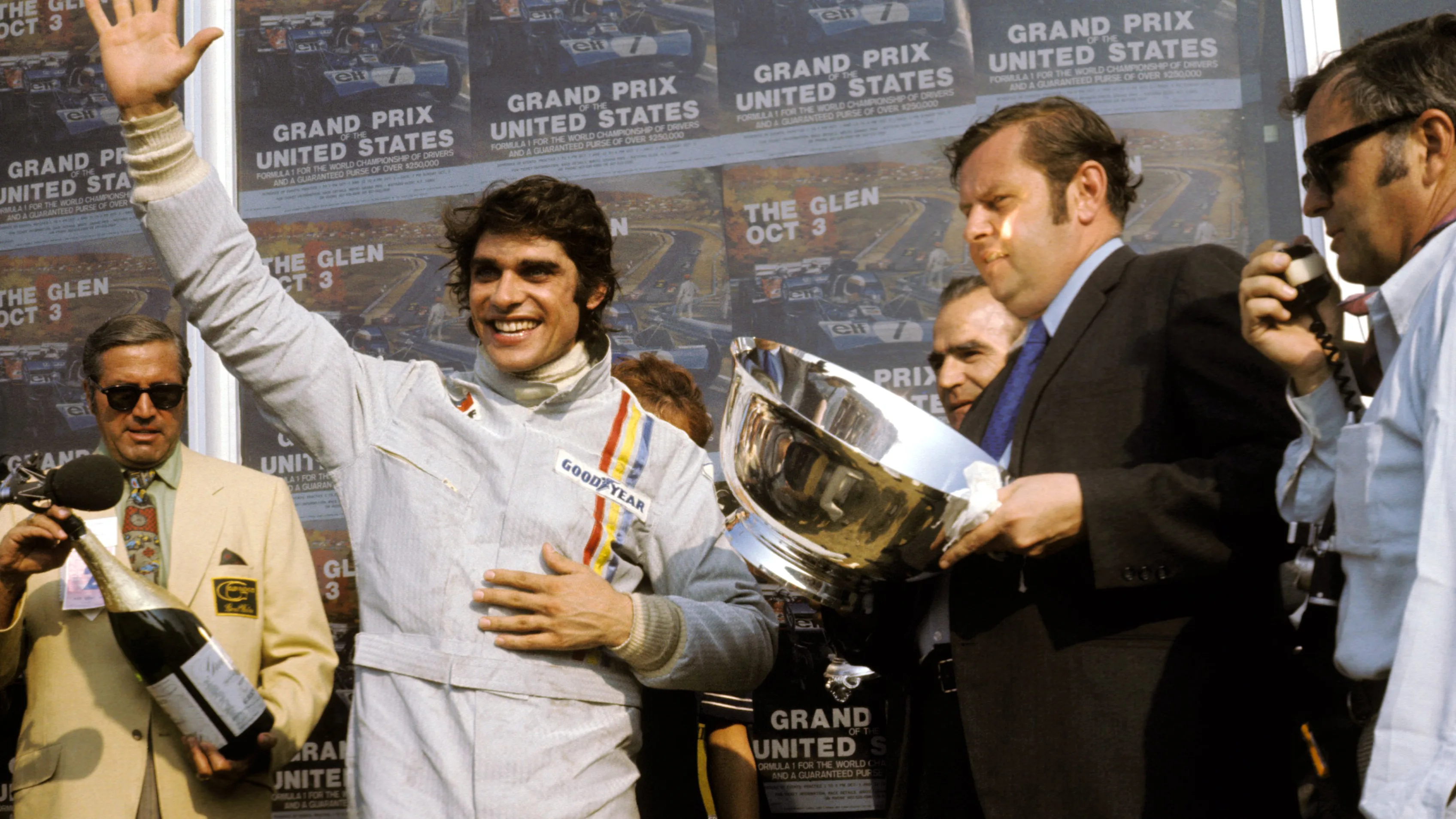 A jubilant Francois Cevert (FRA) Tyrrell celebrates his first GP victory on the podium in the final