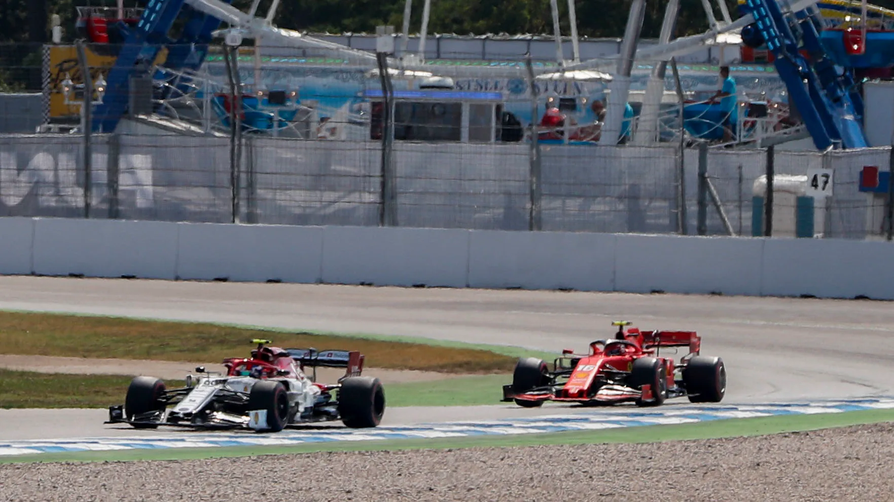 HOCKENHEIMRING, GERMANY - JULY 26: Antonio Giovinazzi, Alfa Romeo Racing C38, leads Charles