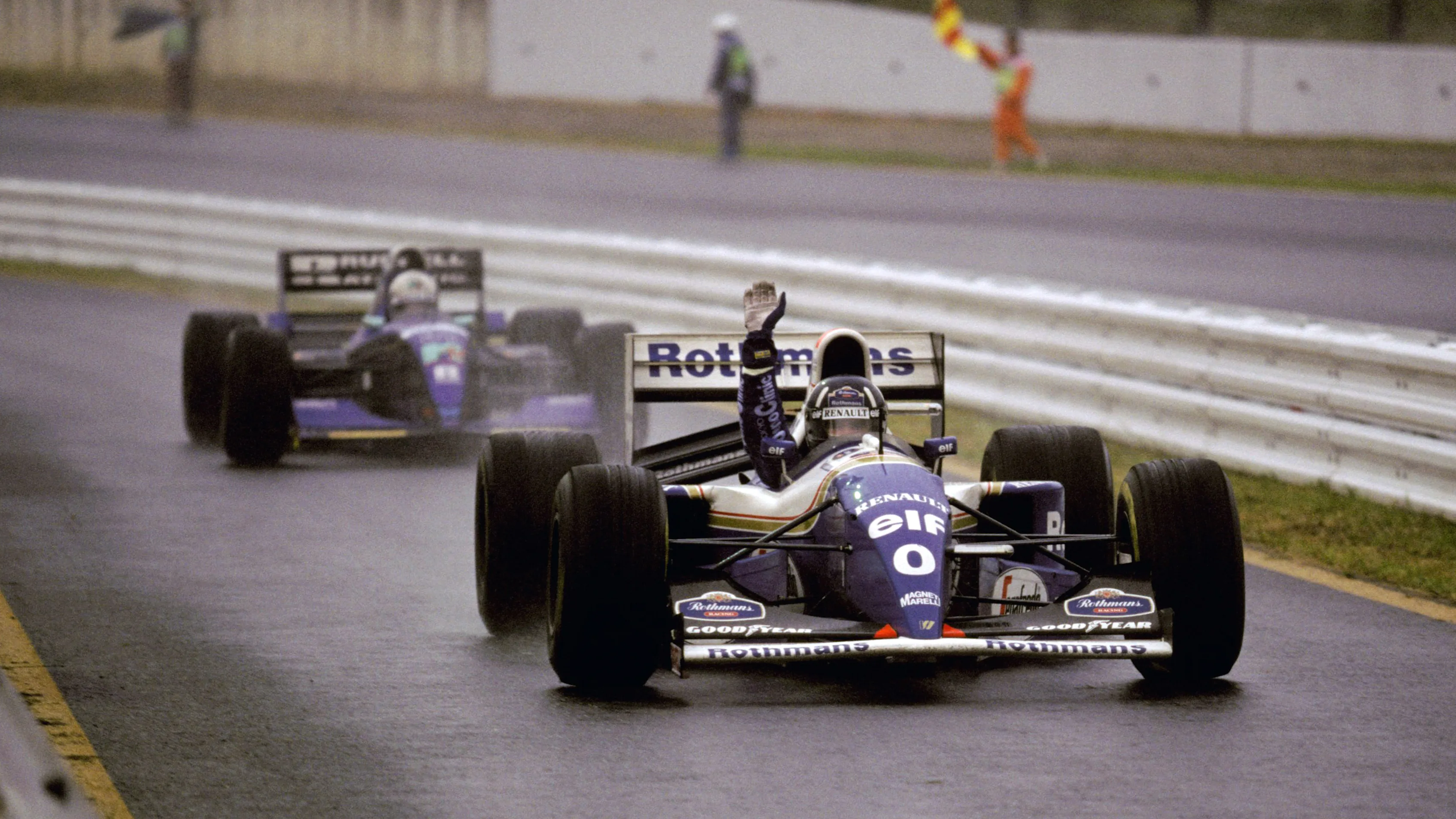 Damon Hill (GBR) Williams FW16 celebrates his victory as he enters the pit lane in the appalling