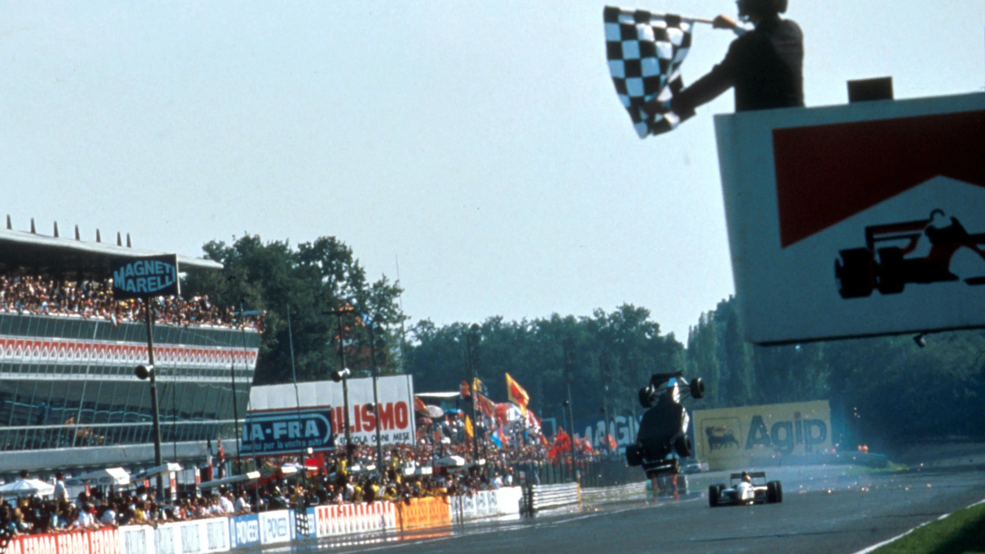 The Minardi Ford of Christian Fittipaldi (BRA) is launched  over his team mate Pierluigi Martini