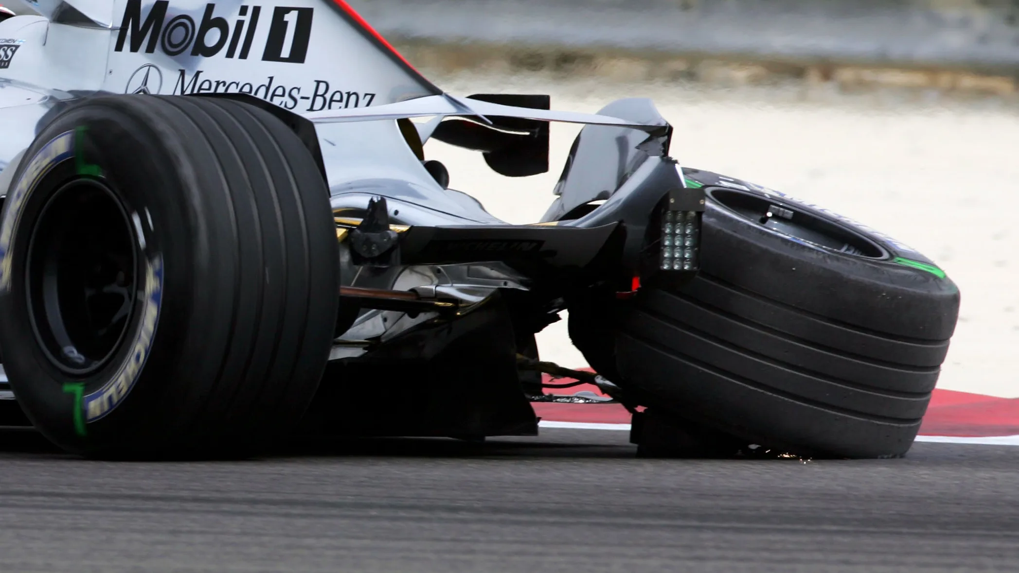 Kimi Raikkonen (FIN) McLaren limps back to the pits during qualifying. Formula One World