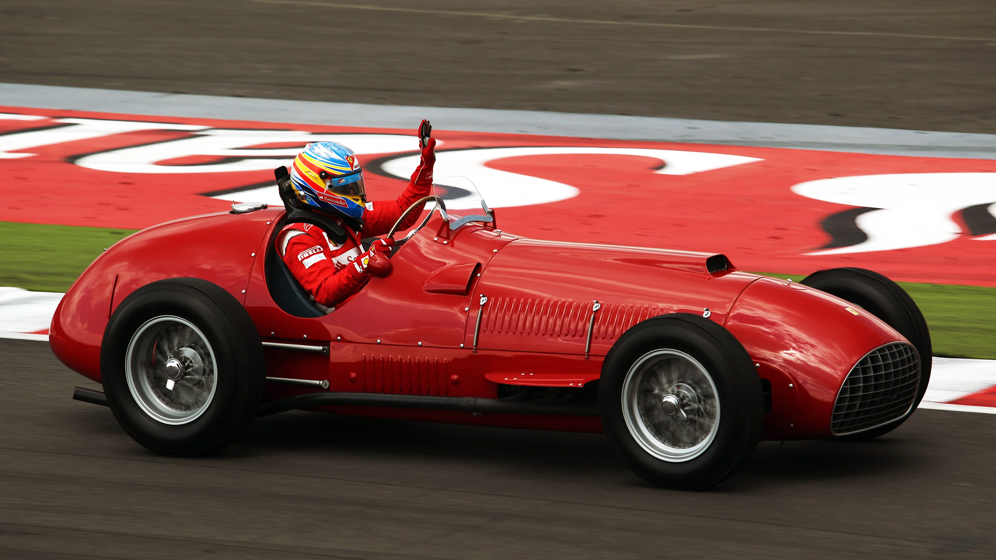 Fernando Alonso (ESP) Ferrari drives a 1951 Ferrari 375.  Formula One World Championship, Rd 9,