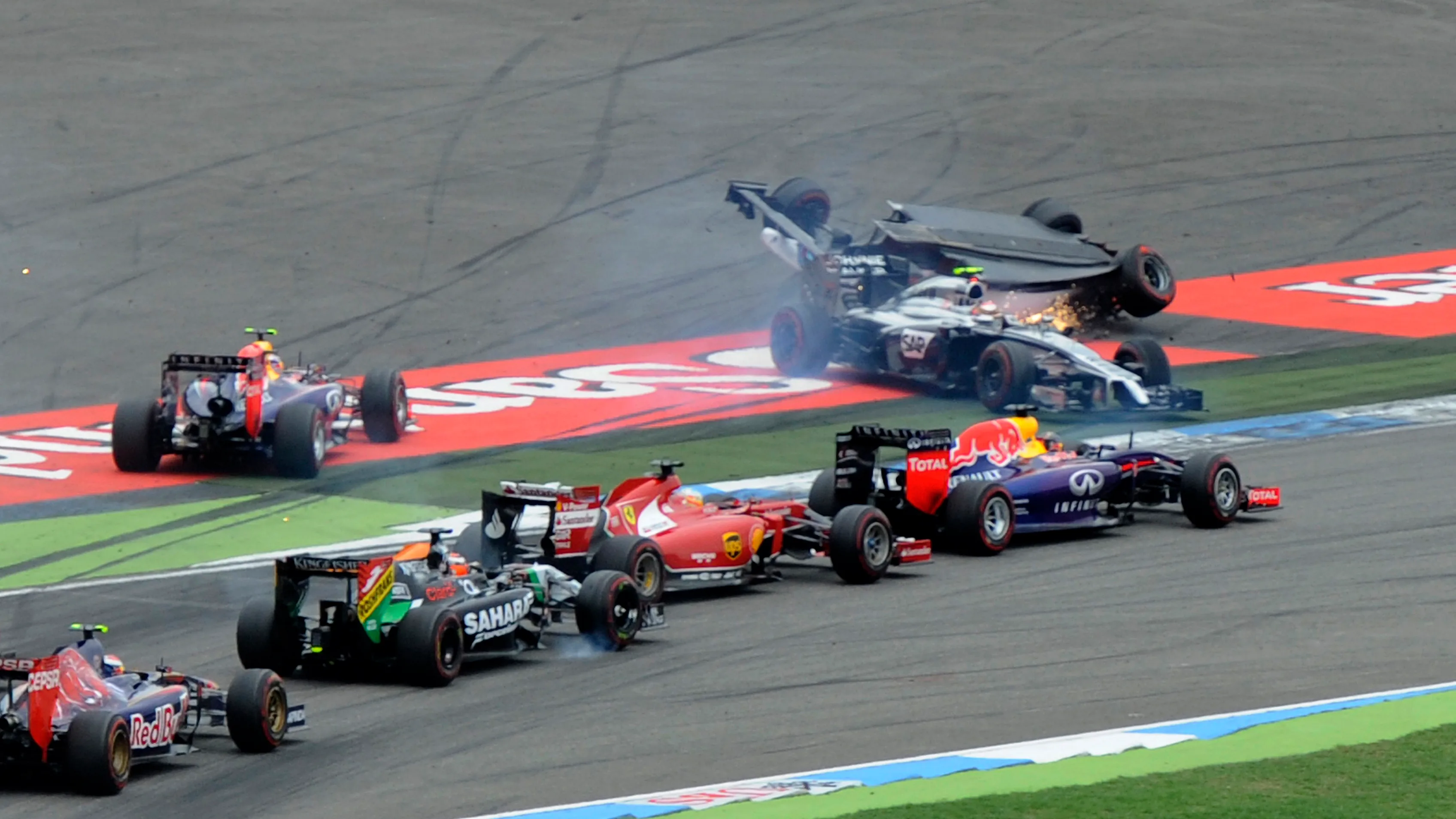 Felipe Massa (BRA) Williams FW36 and Kevin Magnussen (DEN) McLaren MP4-29 collide at the start of