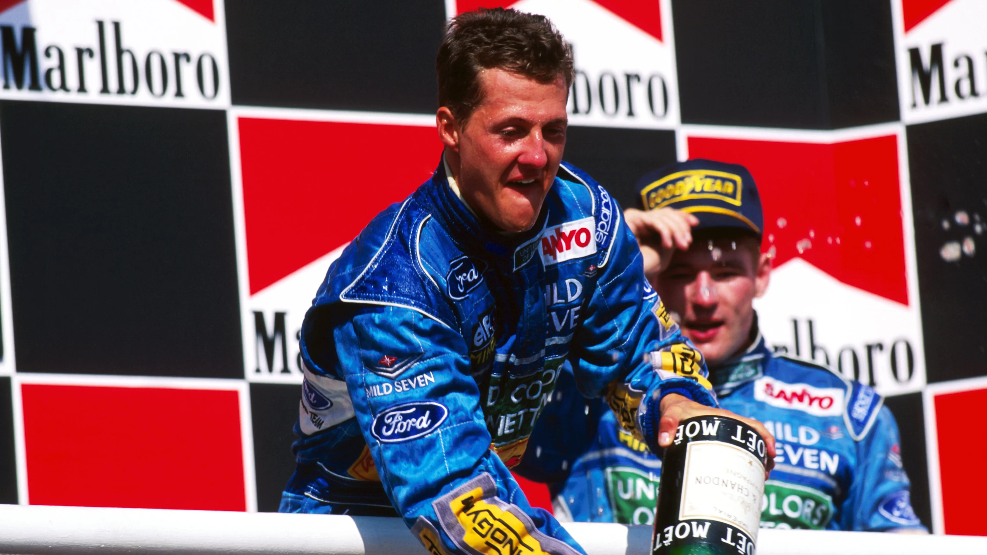 Race winner Michael Schumacher (GER) Benetton celebrates on the podium. His team mate Jos
