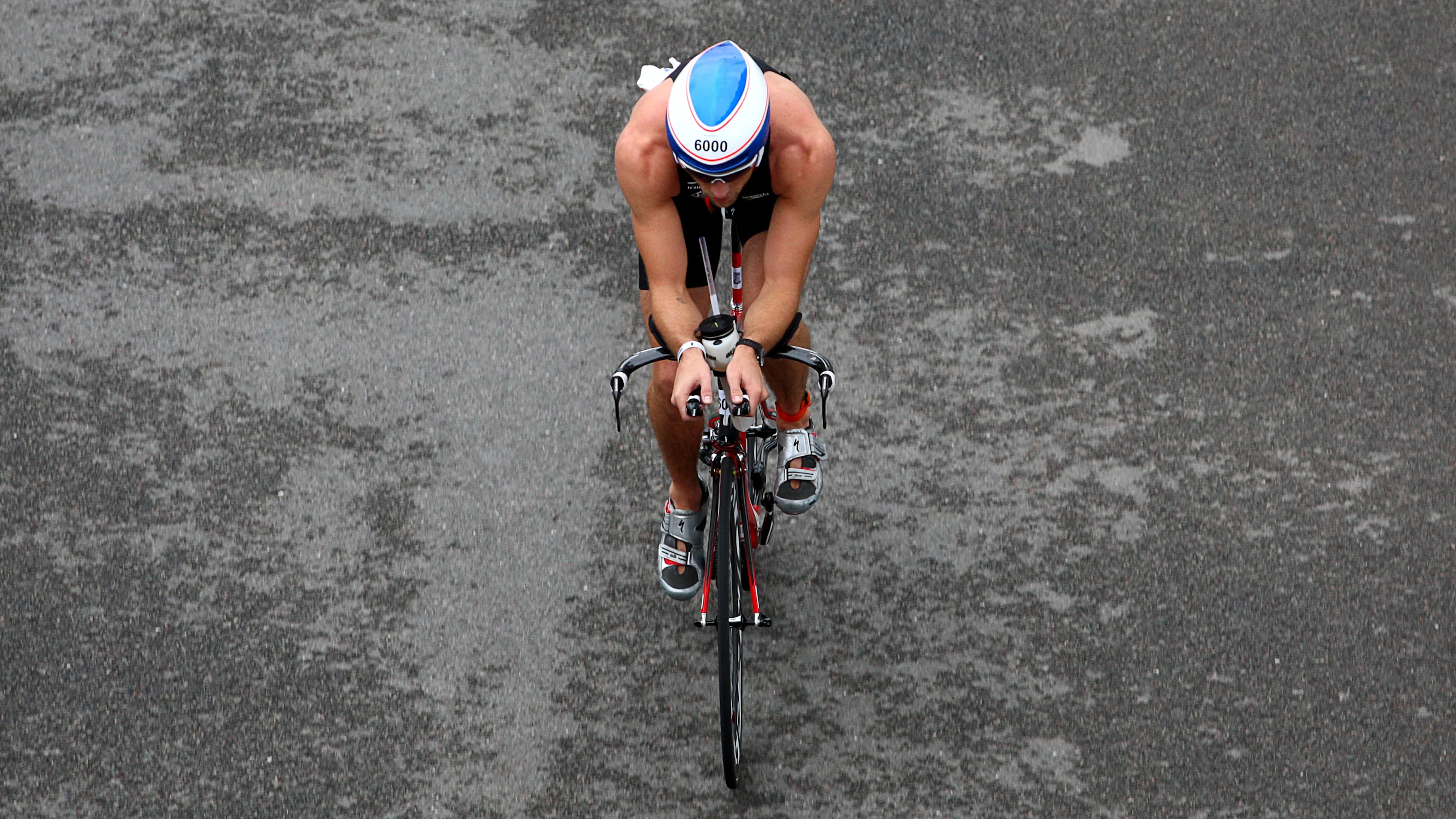 McLaren's Jenson Button is a regular participant in triathlons. Here he is taking part in the 2010 London Triathlon in aid of Make-A-Wish Foundation UK. © Sutton Motorsport Images