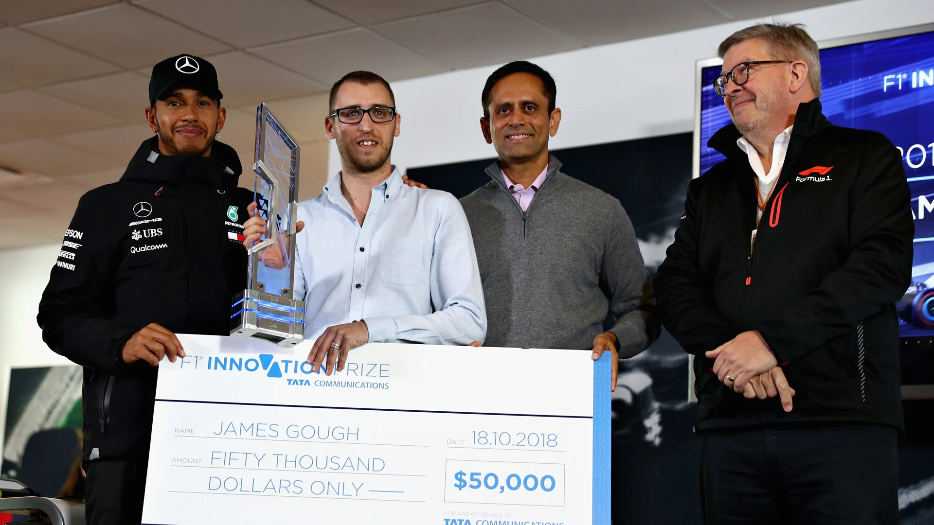 AUSTIN, TX - OCTOBER 18: James Gough is presented with his trophy during the TATA Communications