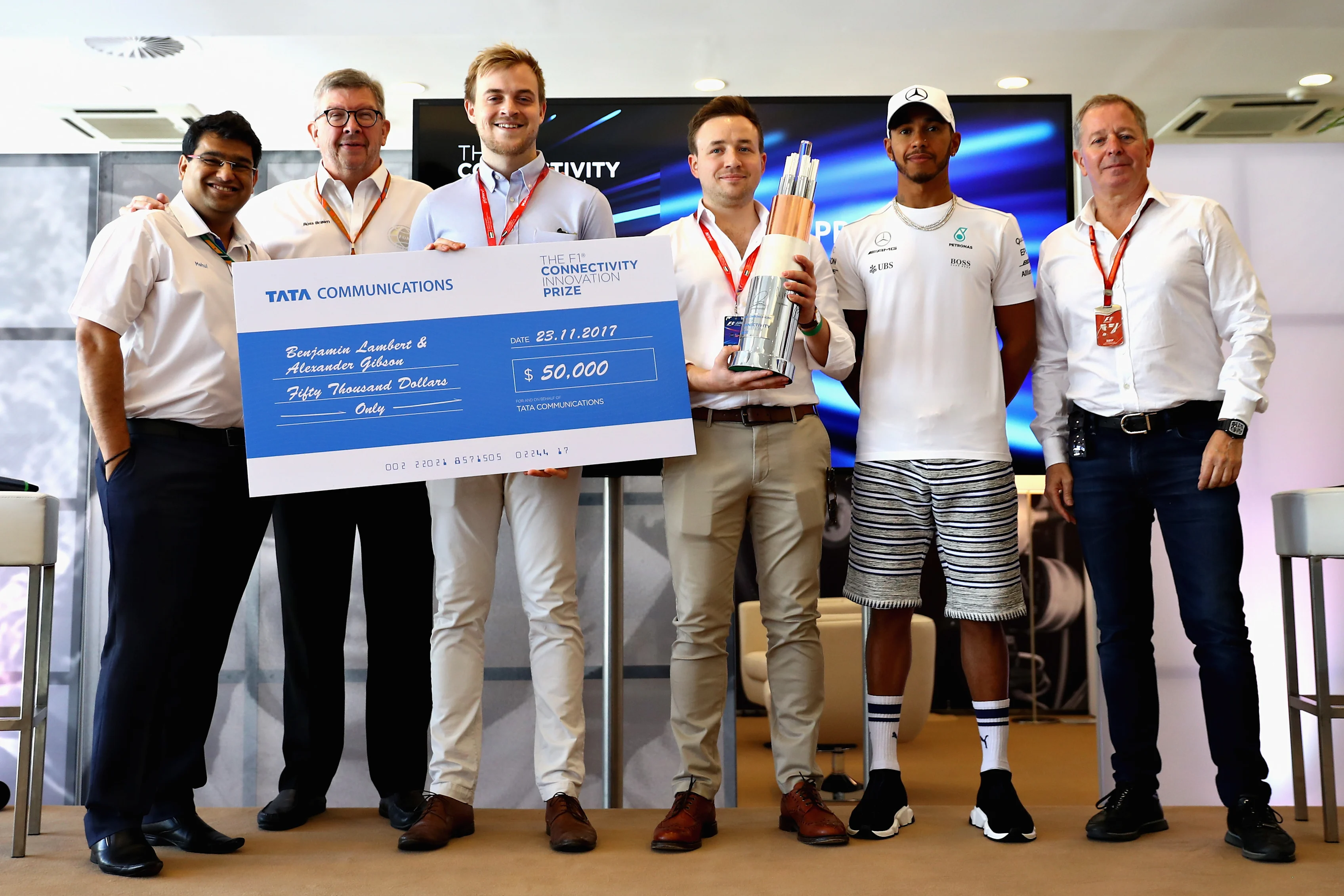 ABU DHABI, UNITED ARAB EMIRATES - NOVEMBER 23:  Benjamin Lambert and Alexander Gibson are presented