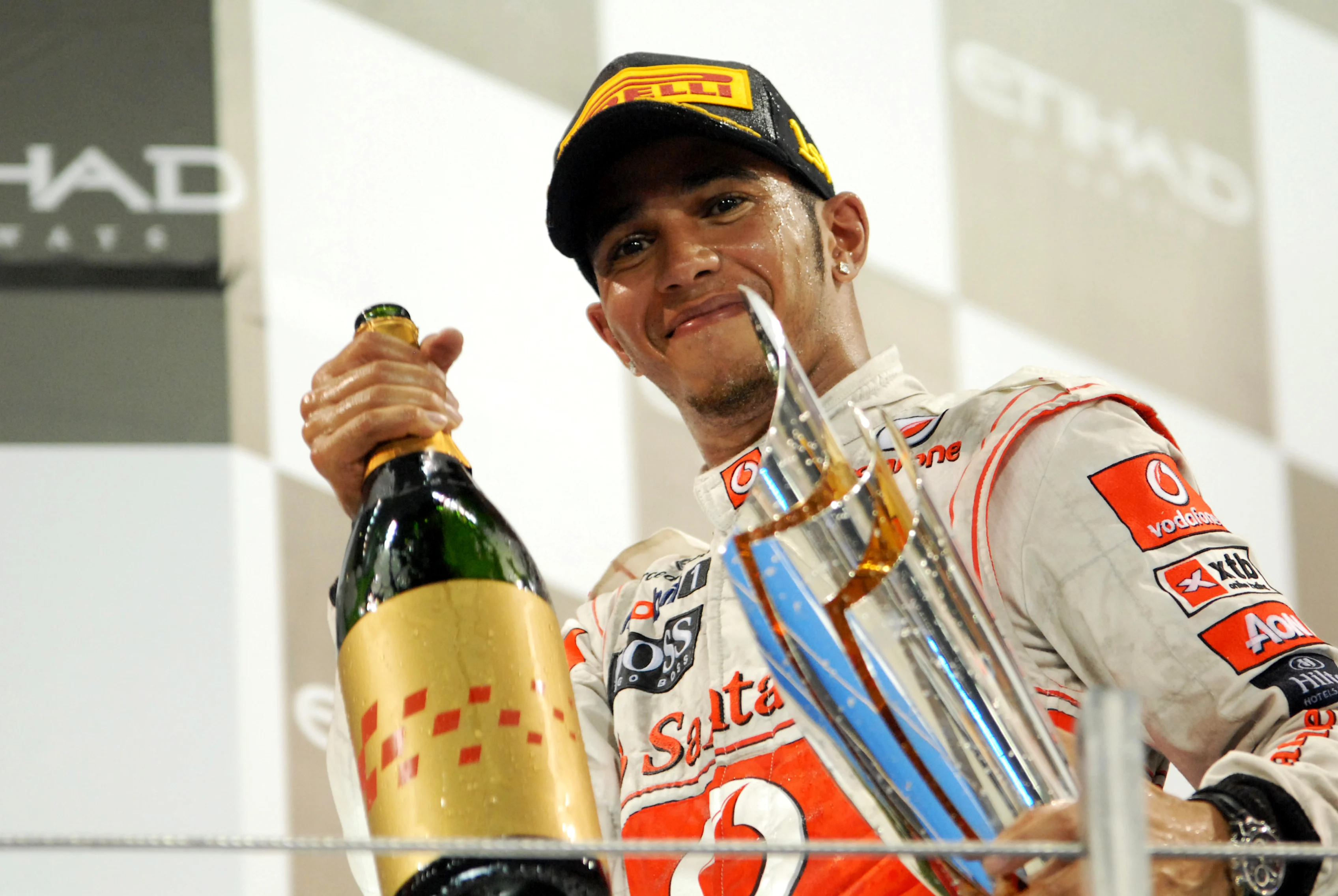 Race winner Lewis Hamilton (GBR) McLaren celebrates on the podium.  Formula One World