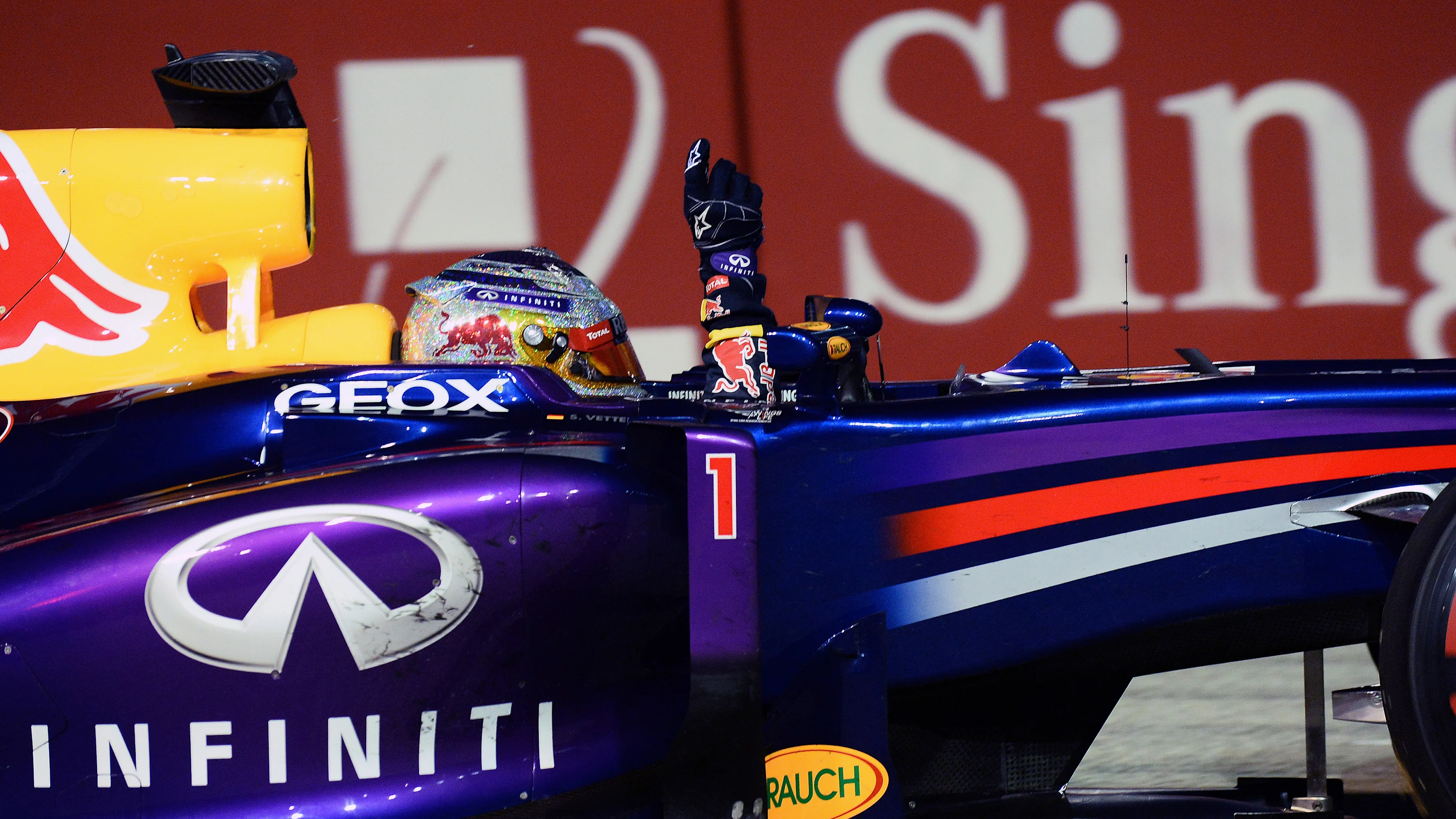 Sebastian Vettel (GER) Red Bull Racing RB9 crosses the finish line to win the race. Formula One