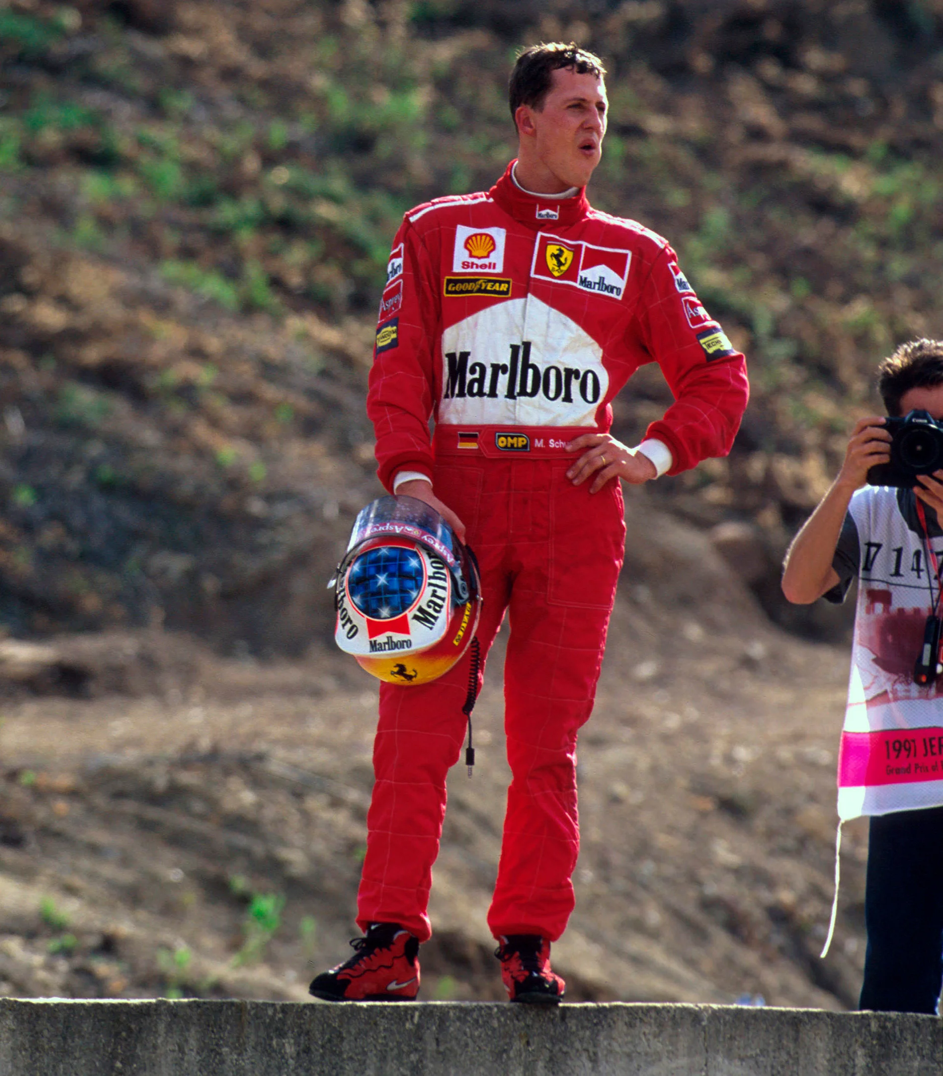 Jerez, Spain.
24-26 October 1997.
Michael Schumacher (Ferrari) takes a moment to reflect, after the