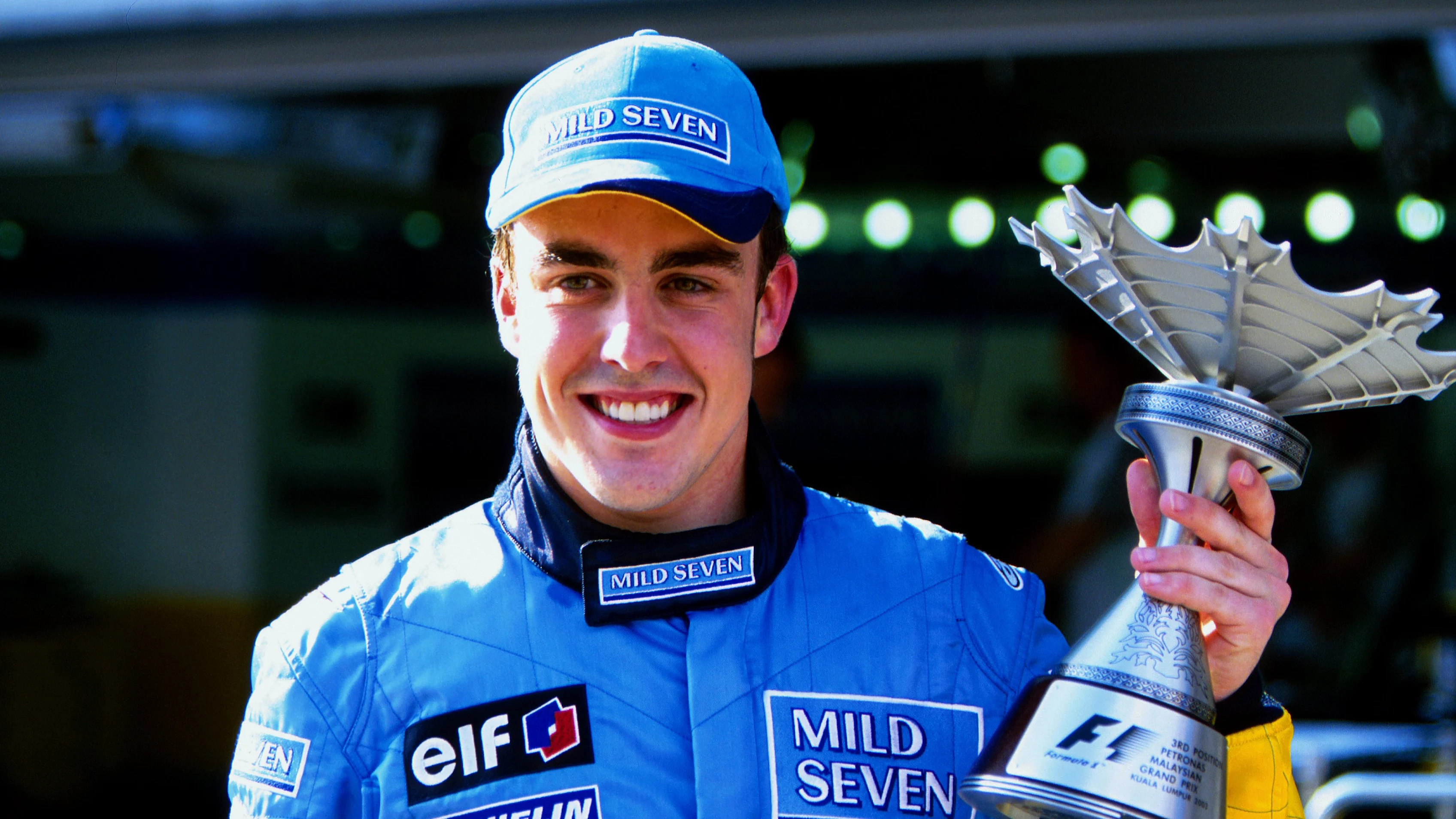 Fernando Alonso (ESP) Renault poses with his third place trophy.
Formula One World Championship, Rd