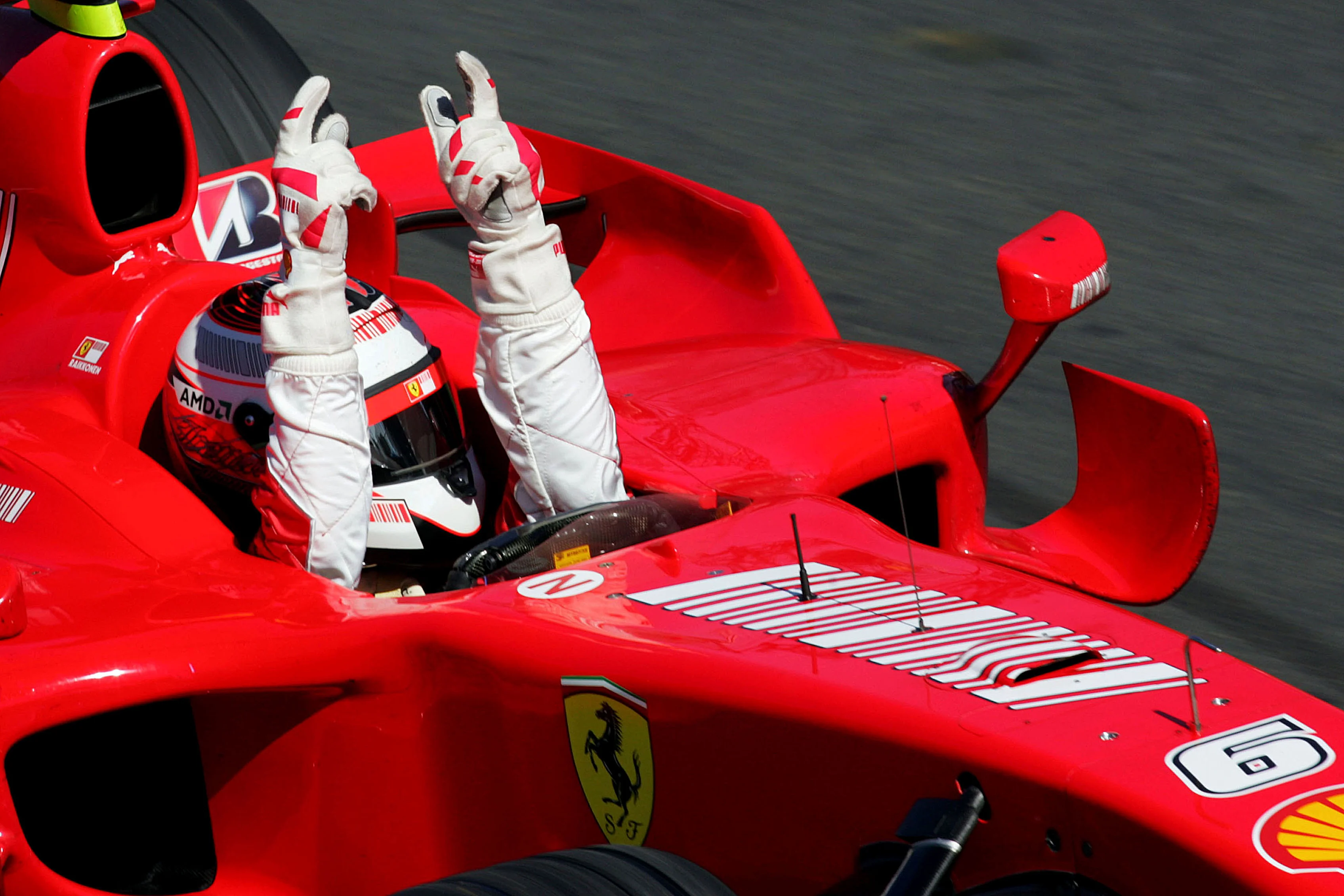 Race winner Kimi Raikkonen (FIN) Ferrari F2007 takes the chequered flag. Formula One World