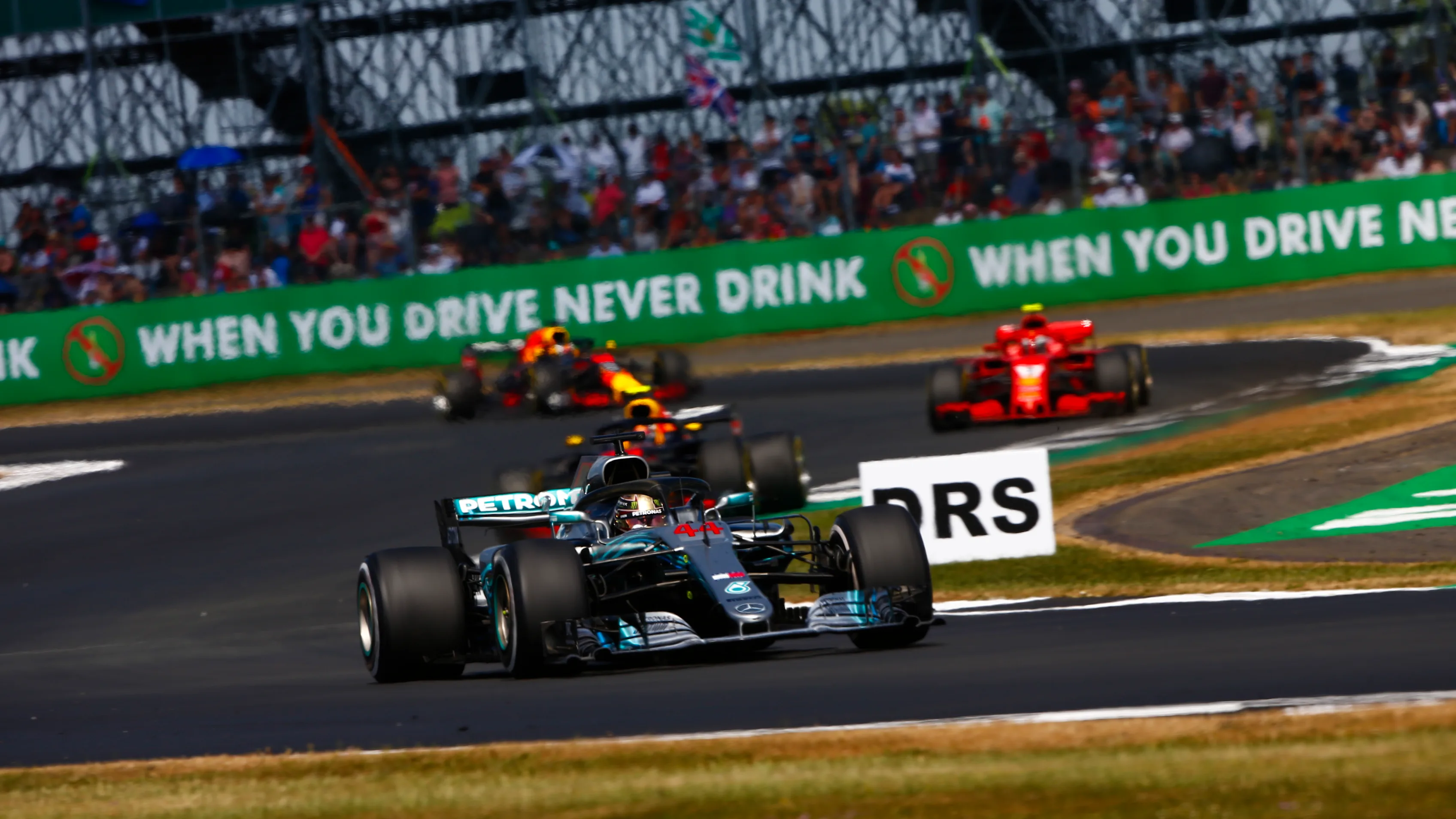SILVERSTONE, UNITED KINGDOM - JULY 08: Lewis Hamilton, Mercedes AMG F1 W09, leads Max Verstappen,