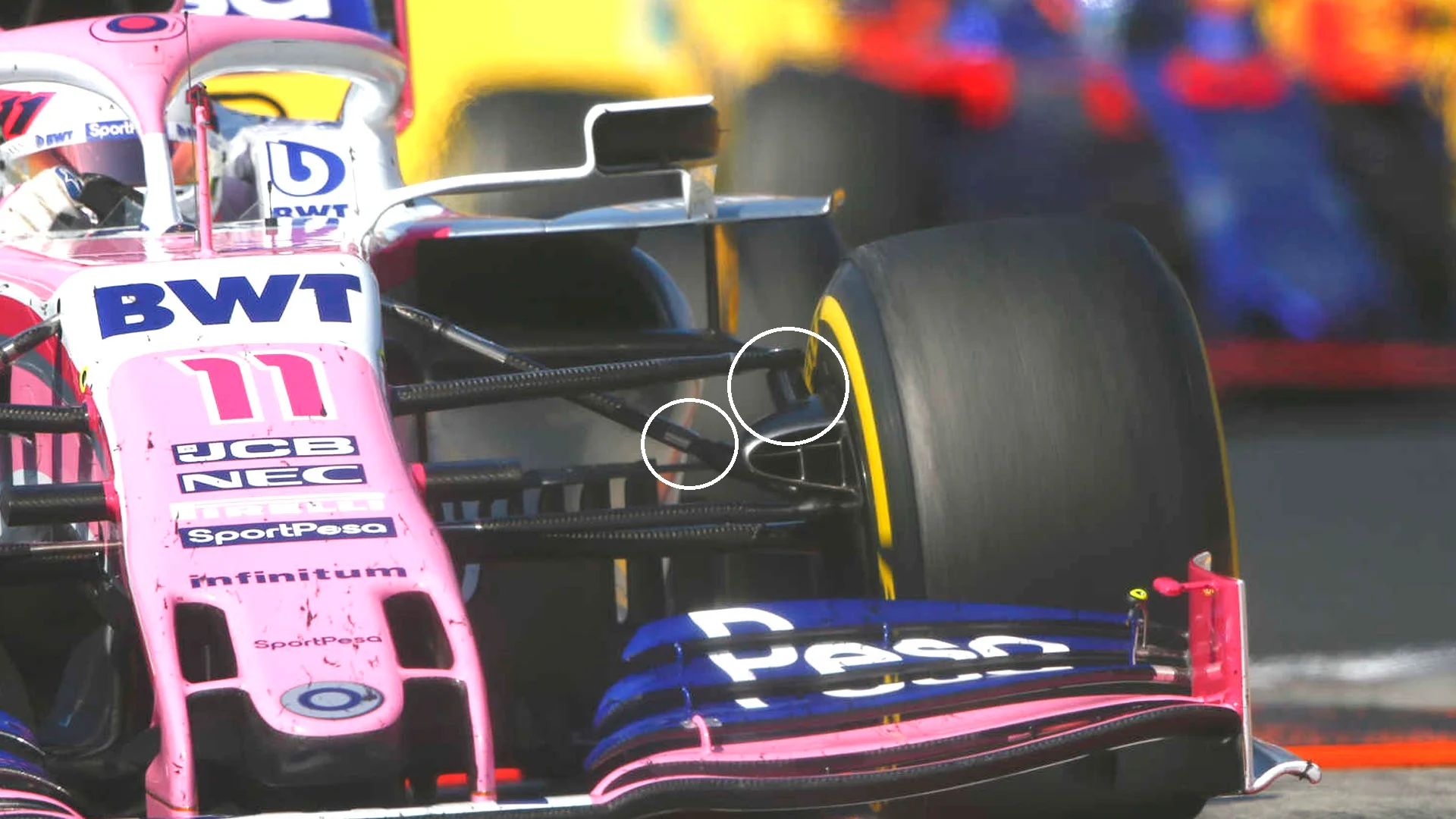 HUNGARORING, HUNGARY - AUGUST 04: Sergio Perez, Racing Point RP19, leads Alexander Albon, Toro