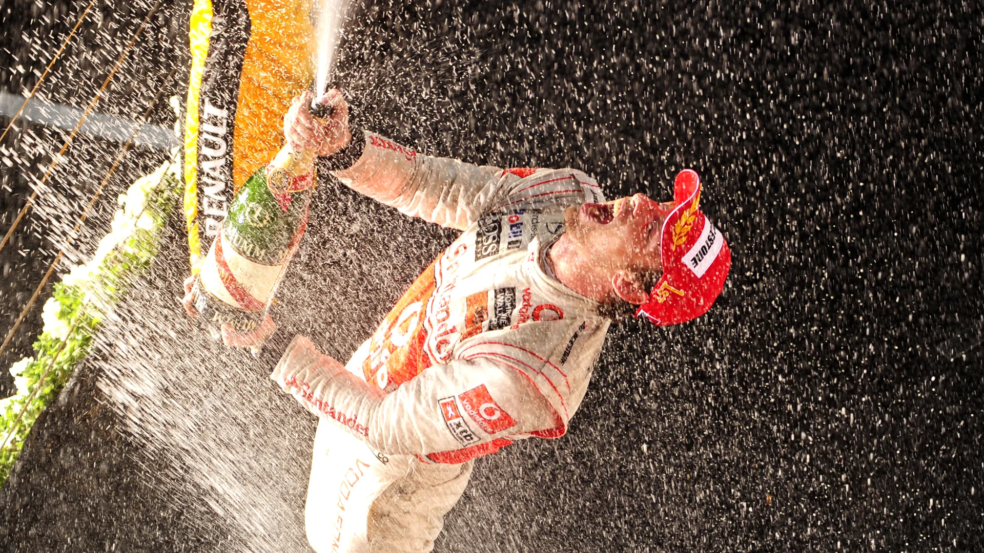 Race winner Jenson Button (GBR) McLaren celebrates on the podium. Formula One World Championship,