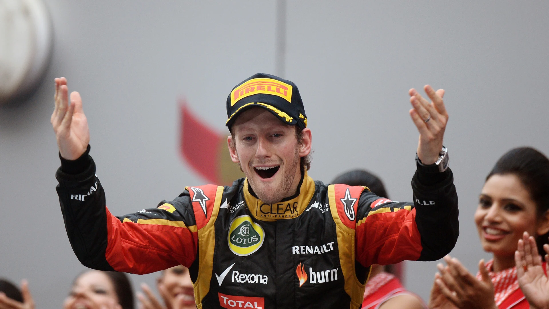 Romain Grosjean (FRA) Lotus F1 celebrates his third place on the podium.
Formula One World Championship, Rd16, Indian Grand Prix, Buddh International Circuit, Greater Noida, New Delhi, India, Race Day, Sunday 27 October 2013. 

BEST IMAGE © Sutton Motorsport Images