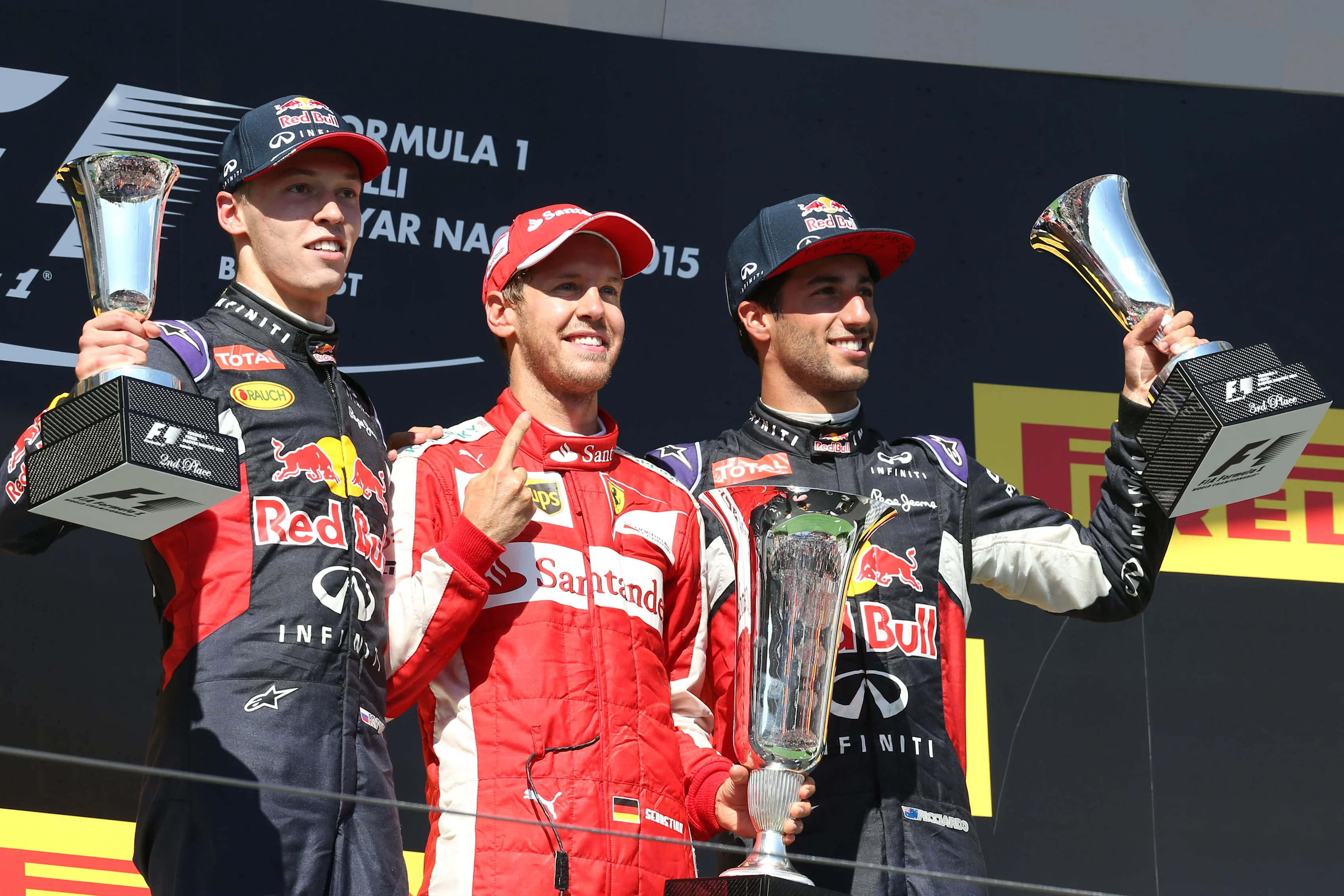 (L to R): Daniil Kyvat (RUS) Red Bull Racing, Race winner Sebastian Vettel (GER) Ferrari and Daniel