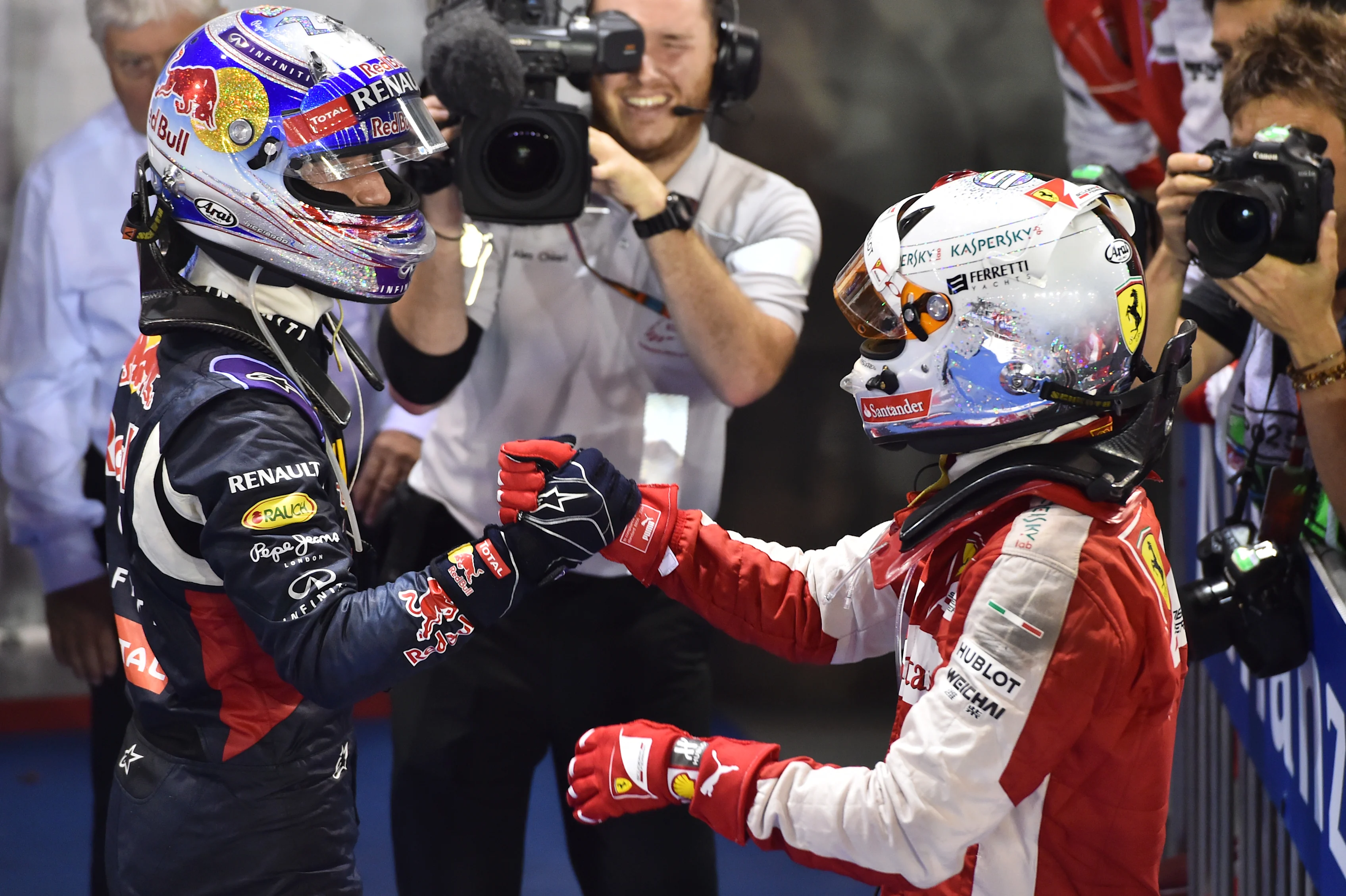 Race winner Sebastian Vettel (GER) Ferrari and second placed Daniel Ricciardo (AUS) Red Bull Racing