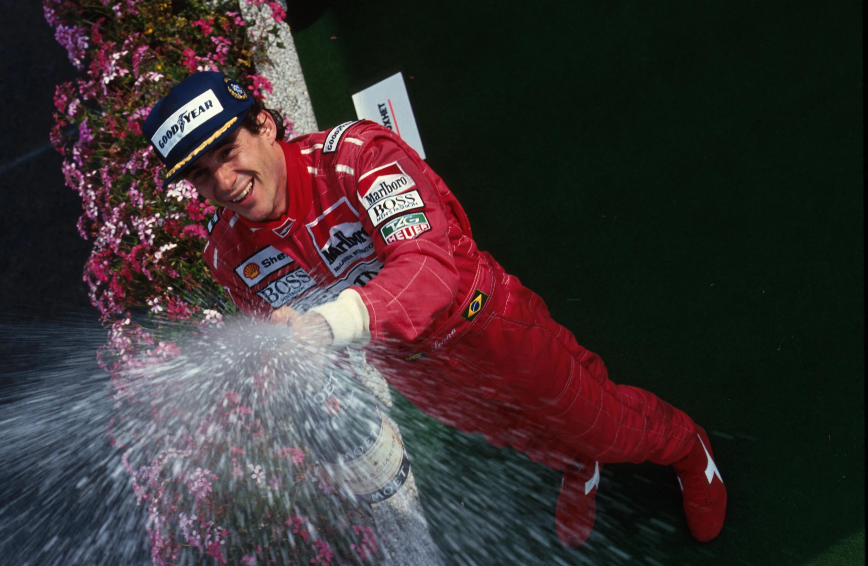 Race winner Ayrton Senna celebrates his victory on the podium.  Belgian Grand Prix, Spa, 25