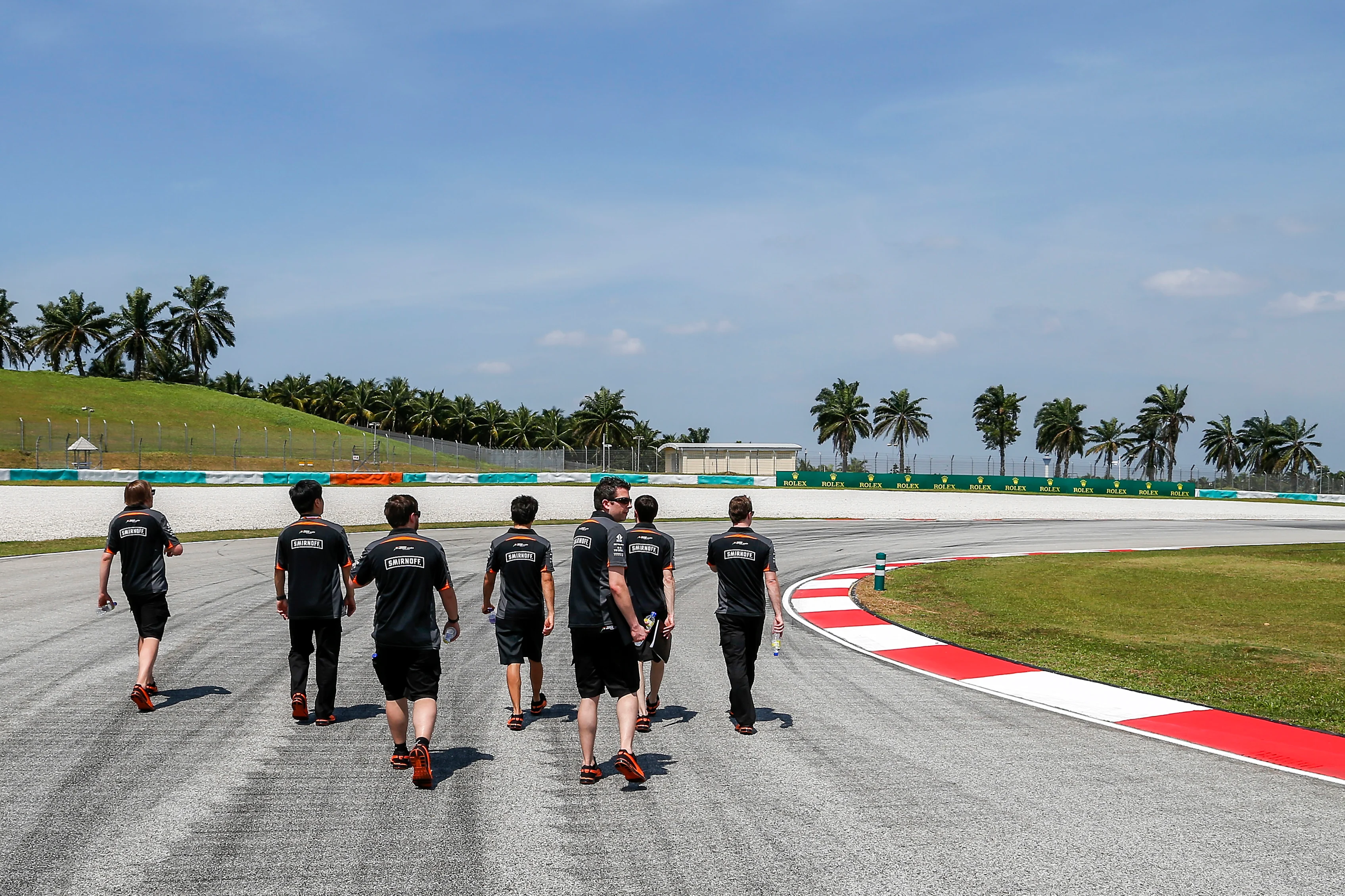 Sergio Perez (Force India) walks the track with members of his team. Malaysian Grand Prix, Preparations, Sepang, Malaysia, Thursday 26 March 2015. © Sutton Motorsport Images