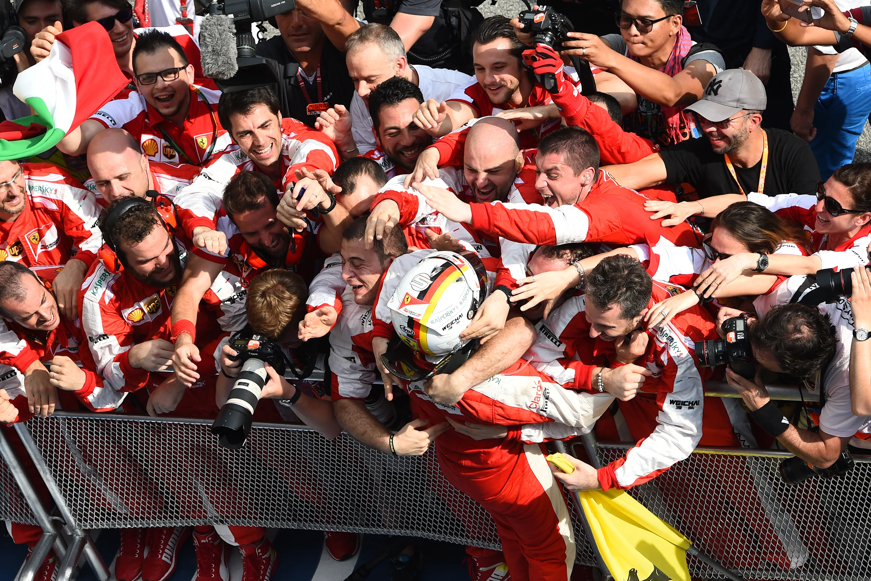 Sebastian Vettel (GER) Ferrari celebrates victory in Parc Ferme at Formula One World Championship,