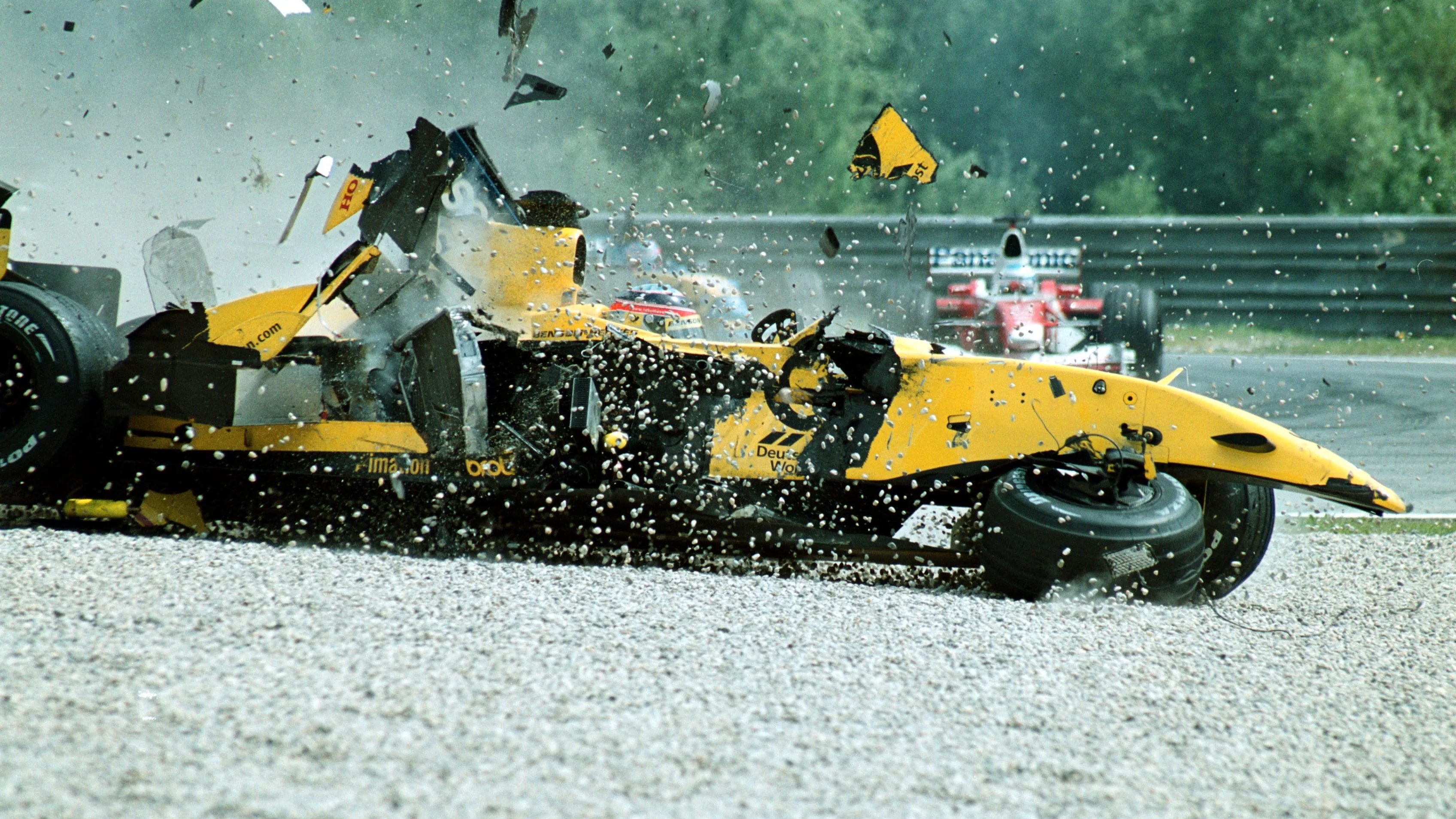 Takuma Sato (JPN) Jordan Honda EJ12 spins into the gravel after a huge accident with Nick Heidfeld (GER). Formula One World Championship, Rd6, Austrian Grand Prix, A1-Ring, Austria. 12 May 2002.  ©Sutton Motorsport Images