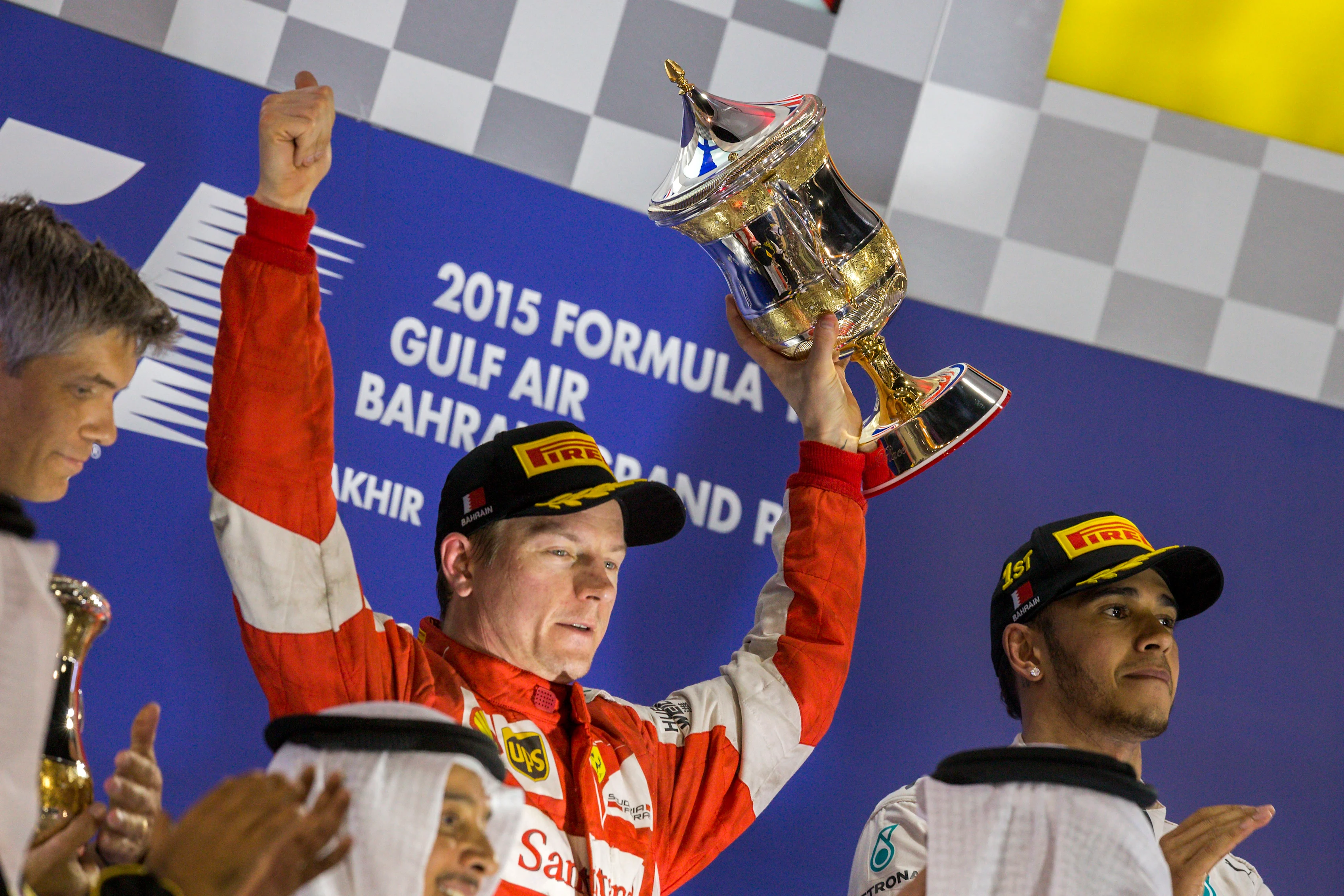 Kimi Raikkonen (FIN) Ferrari with the trophy on the podium at Formula One World Championship, Rd4, Bahrain Grand Prix Race, Bahrain International Circuit, Sakhir, Bahrain, Sunday 19  April 2015. © Sutton Motorsport Images