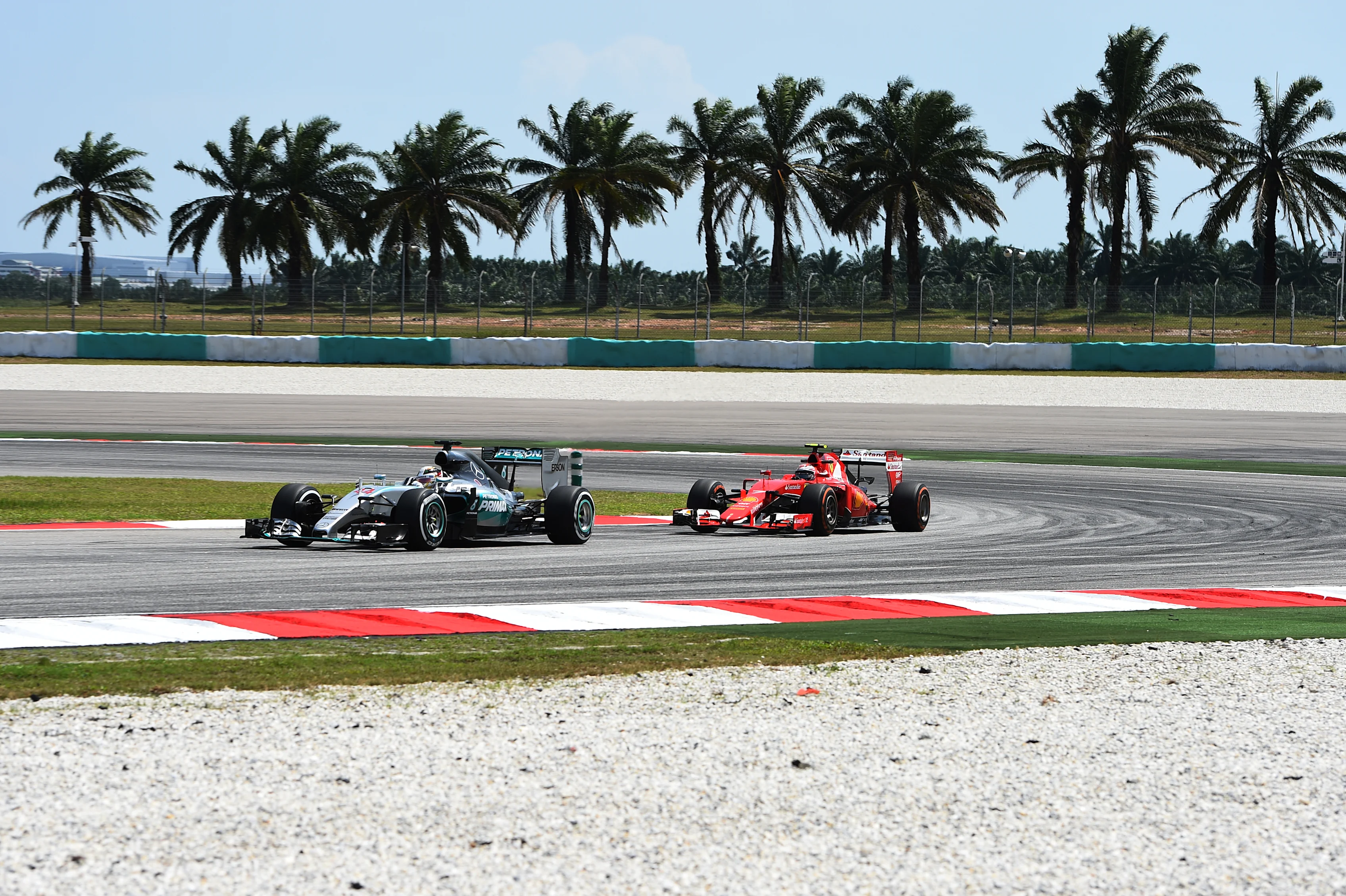 Lewis Hamilton (GBR) Mercedes AMG F1 W06 and Kimi Raikkonen (FIN) Ferrari SF15-T at Formula One