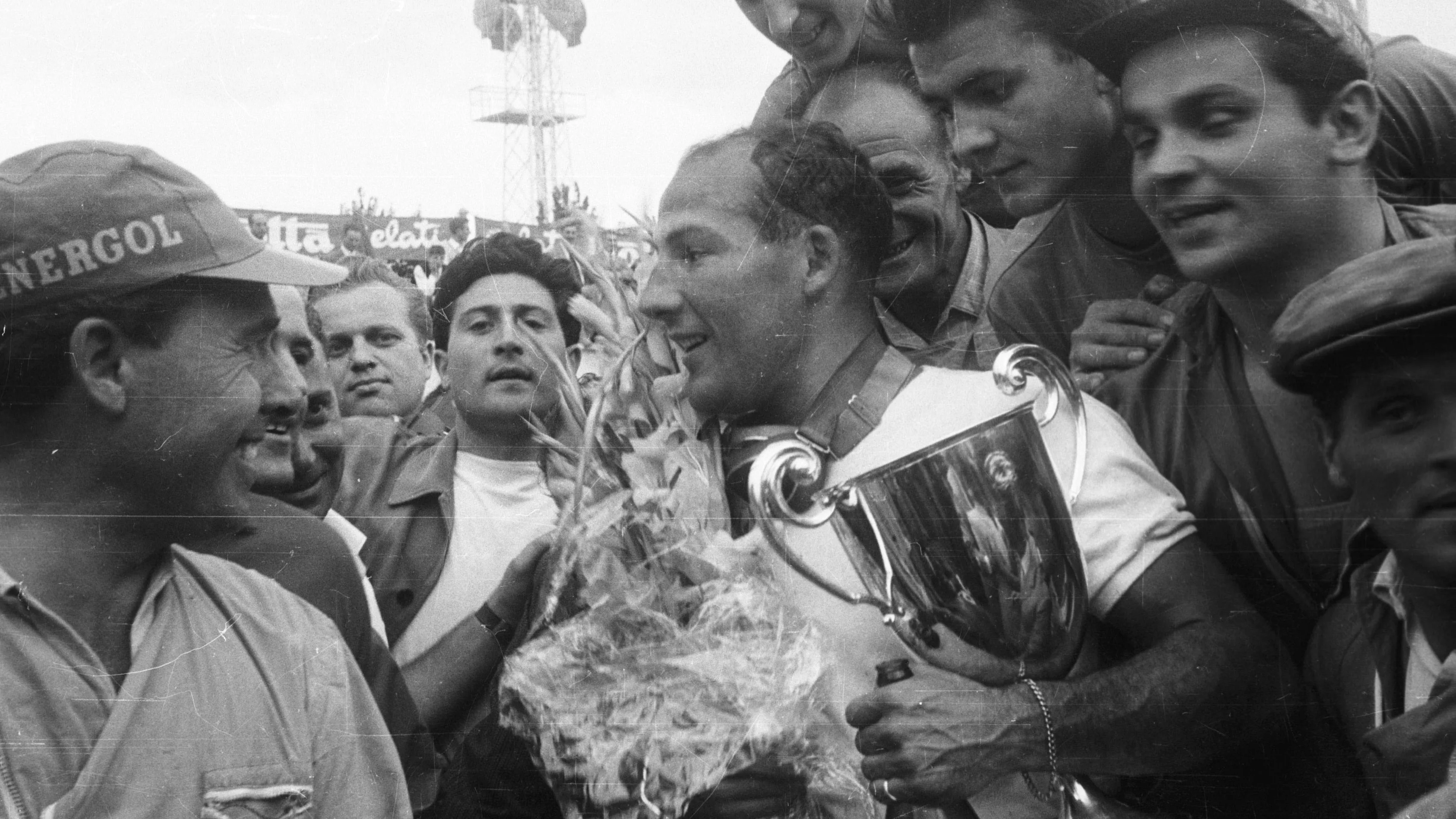 1956 Italian Grand Prix, Monza Stirling Moss (Maserati 250F) 1st position Podium, with the trophy