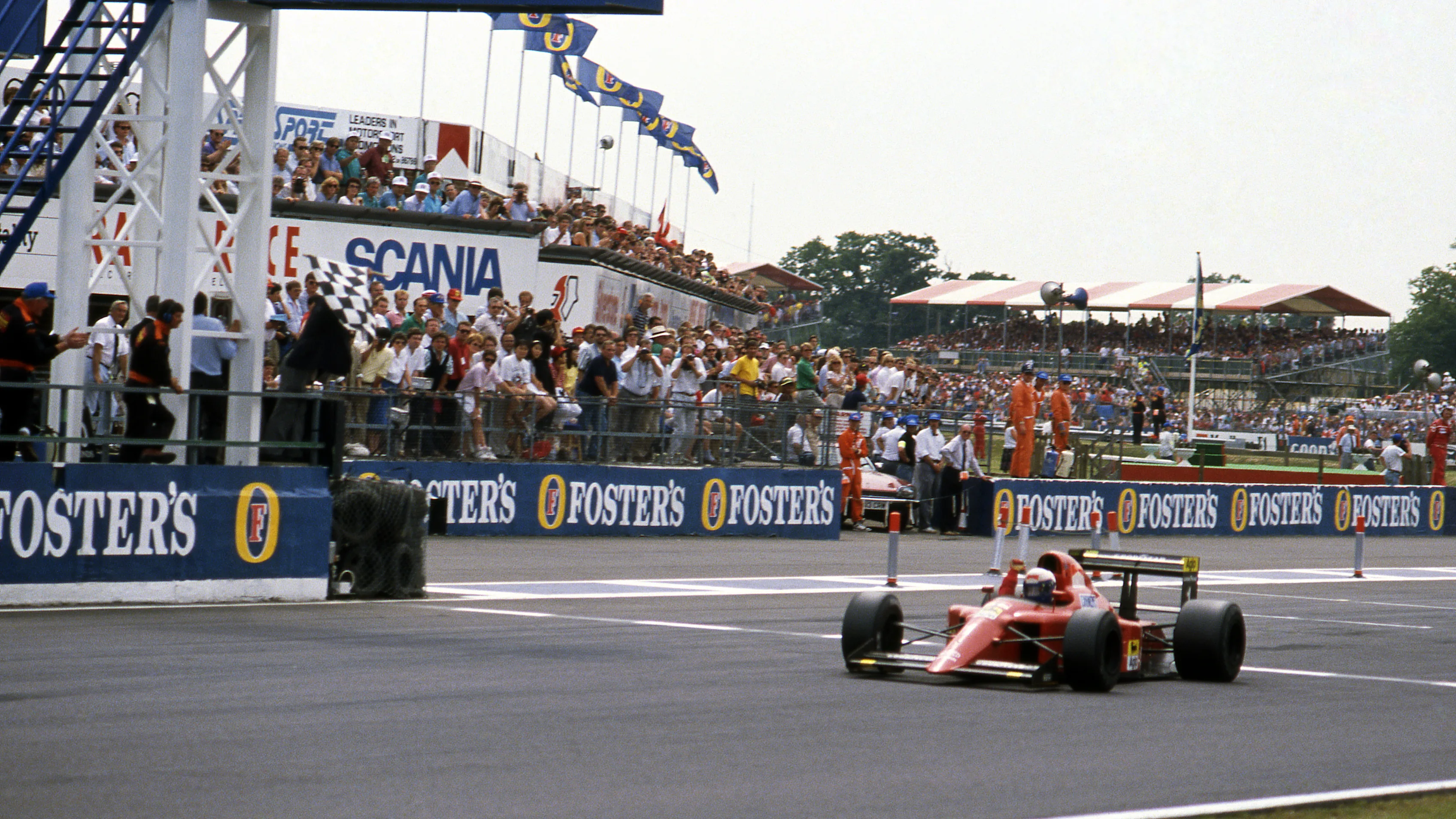 Race winner Alain Prost (FRA) Ferrari 641/2 crosses the line and takes the chequered flag. Formula