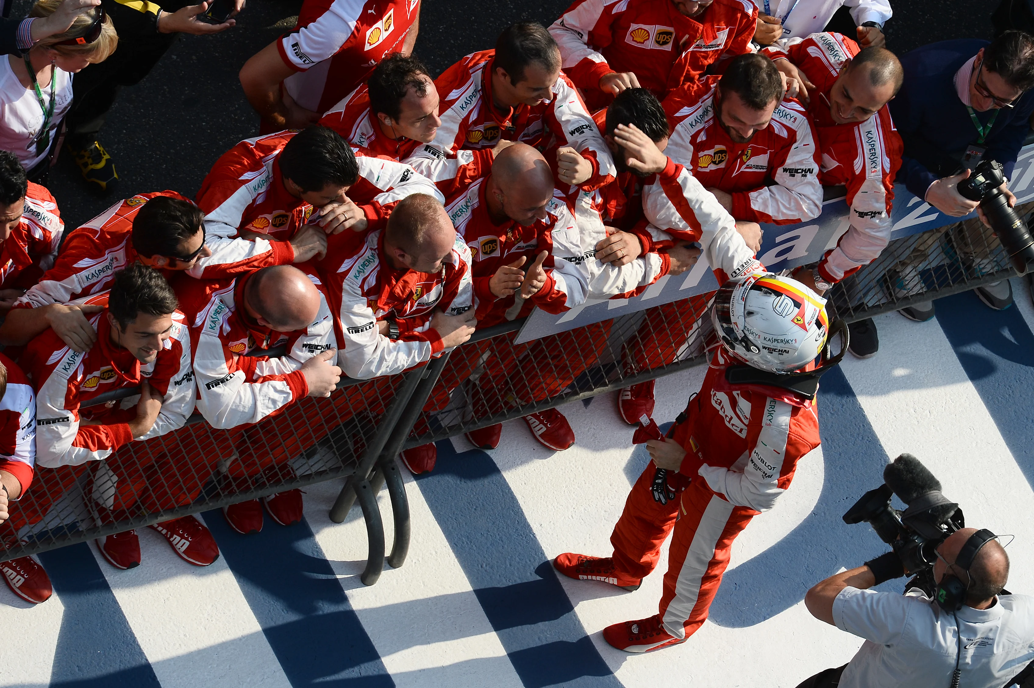 Sebastian Vettel (GER) Ferrari celebrates with the team in Parc Ferme at Formula One World Championship, Rd3, Chinese Grand Prix, Race, Shanghai, China, Sunday 12 April 2015. © Sutton Motorsport Images