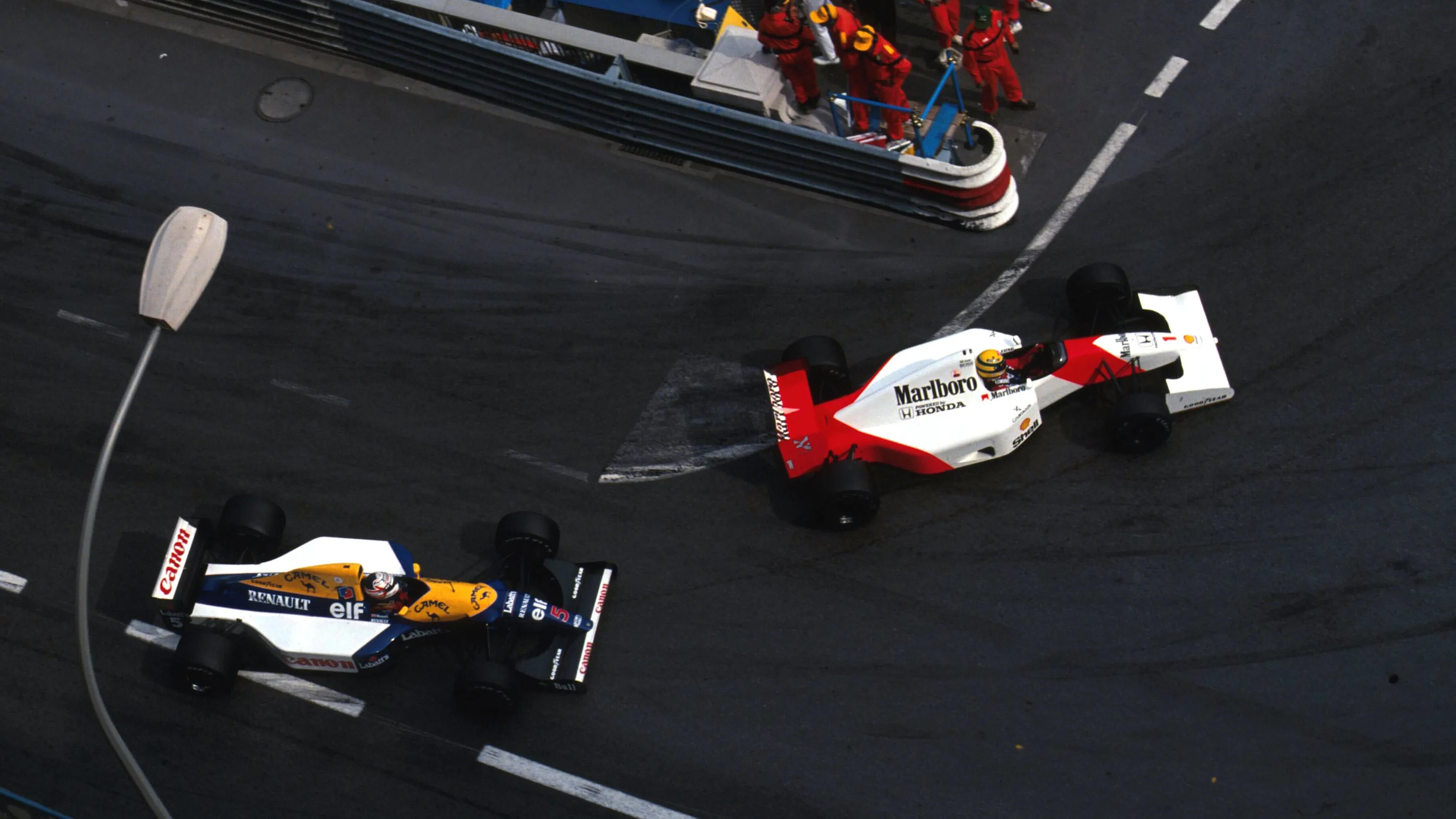Ayrton Senna (BRA) McLaren MP4/6B leads Nigel Mansell (GBR) Williams FW14B during a very closely