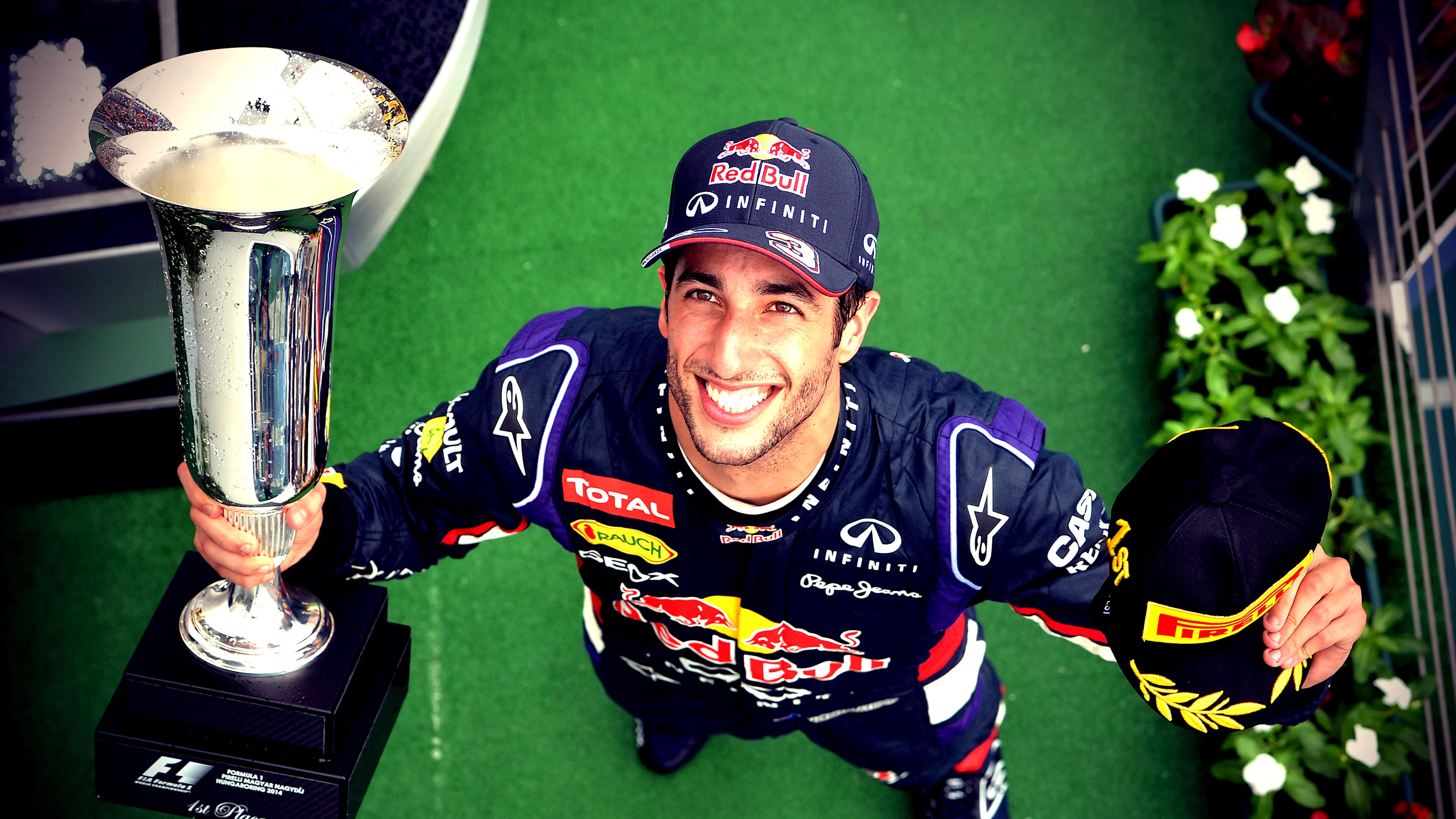 Race winner Daniel Ricciardo (AUS) Red Bull Racing with his trophy On the podium. Formula One