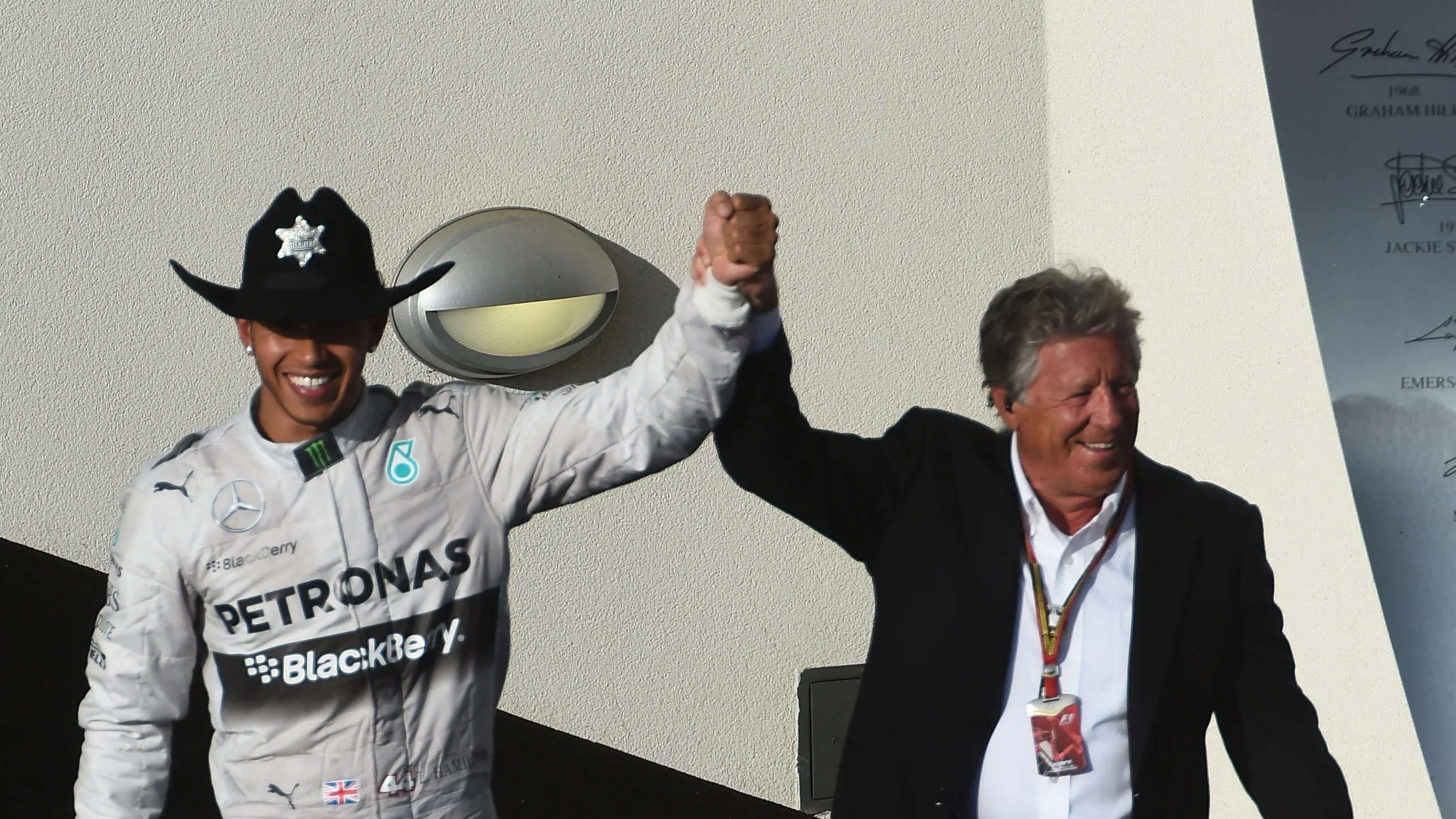 Race winner Lewis Hamilton (GBR) Mercedes AMG F1 wears a stetson On the podium with Mario Andretti