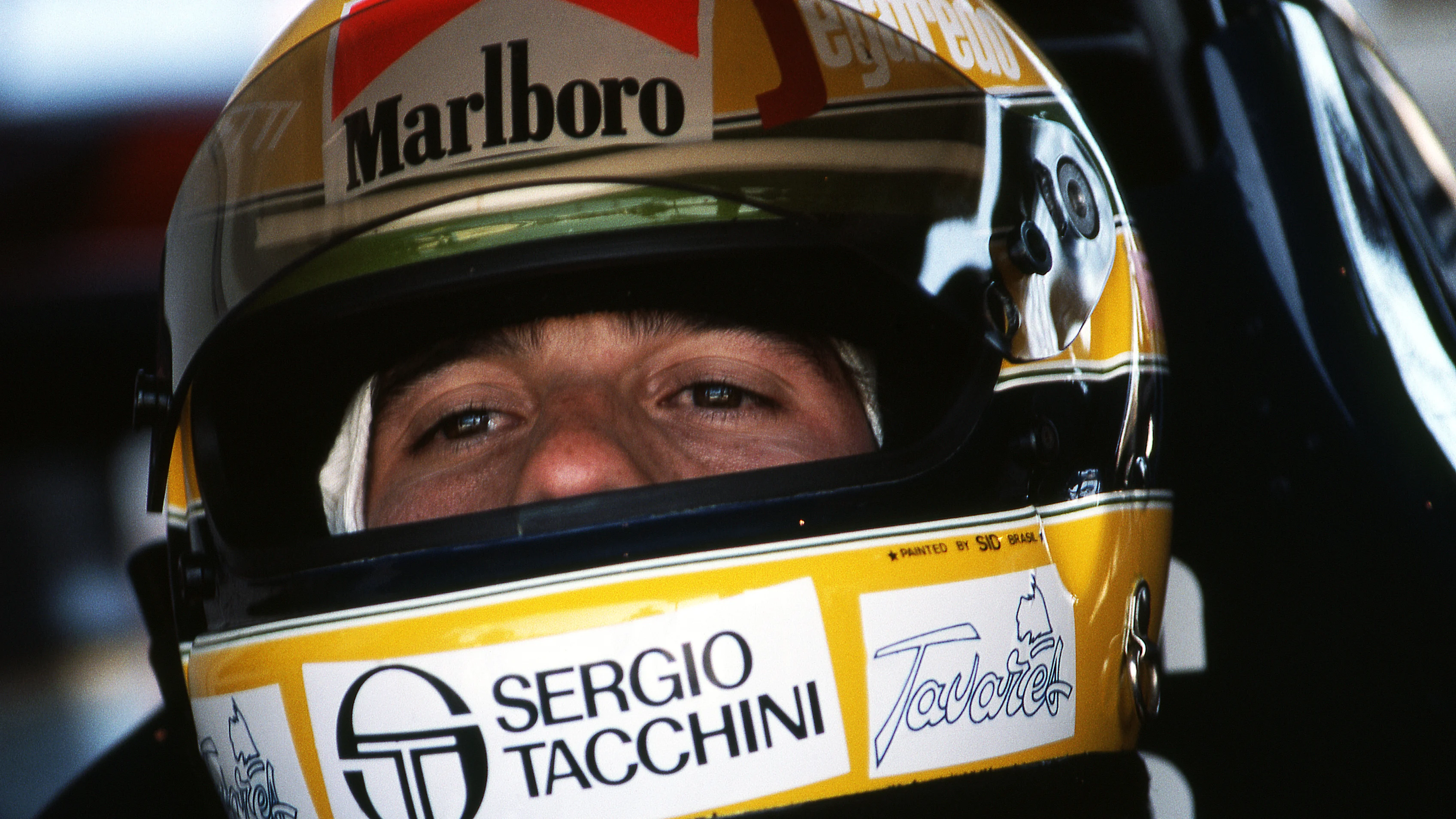 Ayrton Senna (BRA) Toleman TG183B prepares himself before making his Grand Prix debut. The race