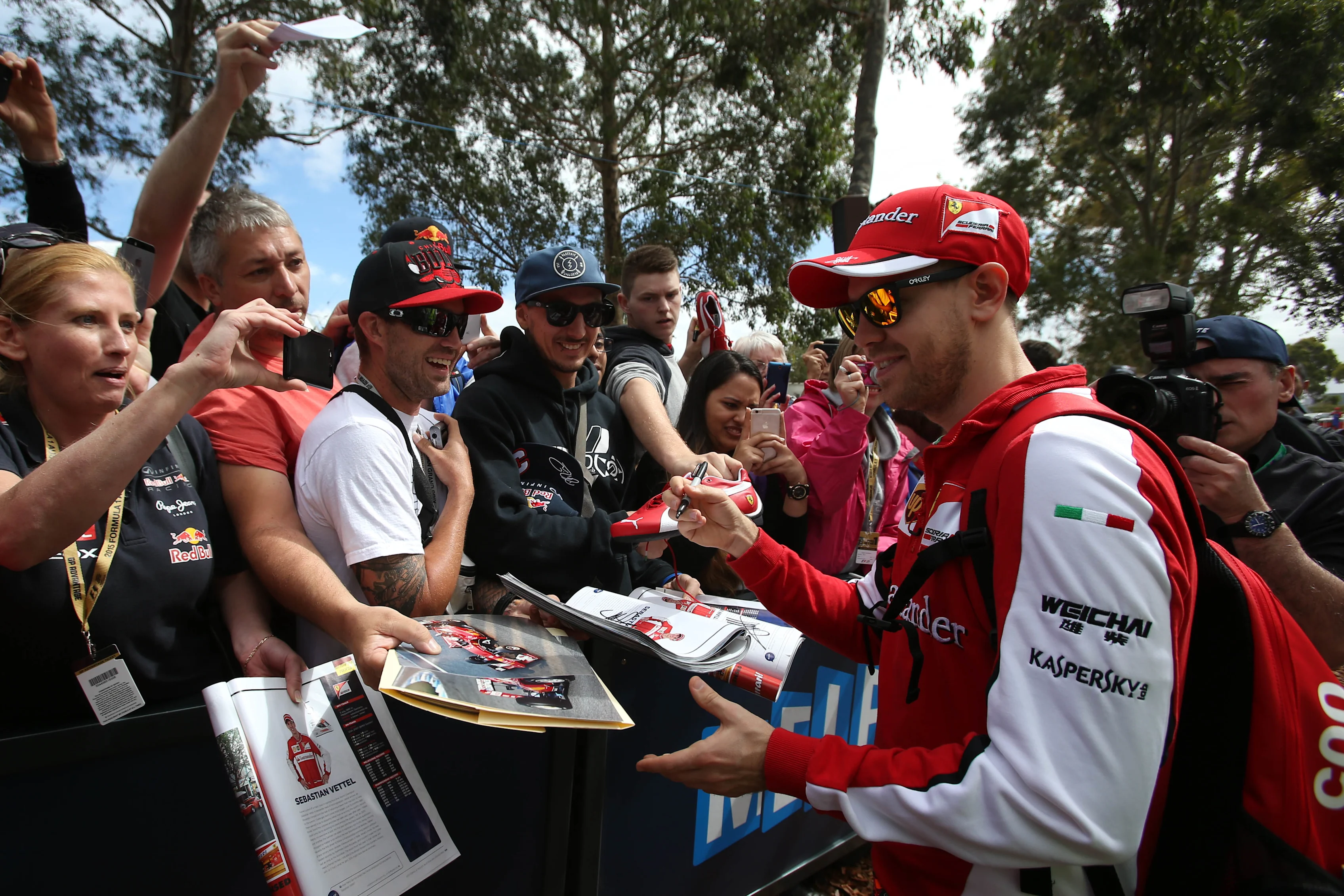 Sebastian Vettel (GER) Ferrari signs autographs for the fans at Formula One World Championship, Rd1, Australian Grand Prix, Preparations, Albert Park, Melbourne, Australia, Thursday 12 March 2015. © Sutton Motorsport Images